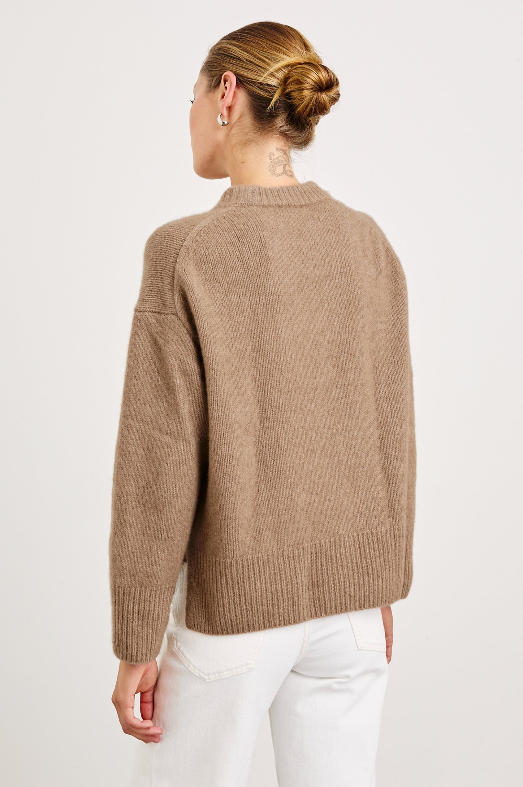 Miranda Long-Sleeve Sweater with a Mock Neck, Side Slits, and Ribbed Trim in Oatmeal Colorway - Back View Featured on Model