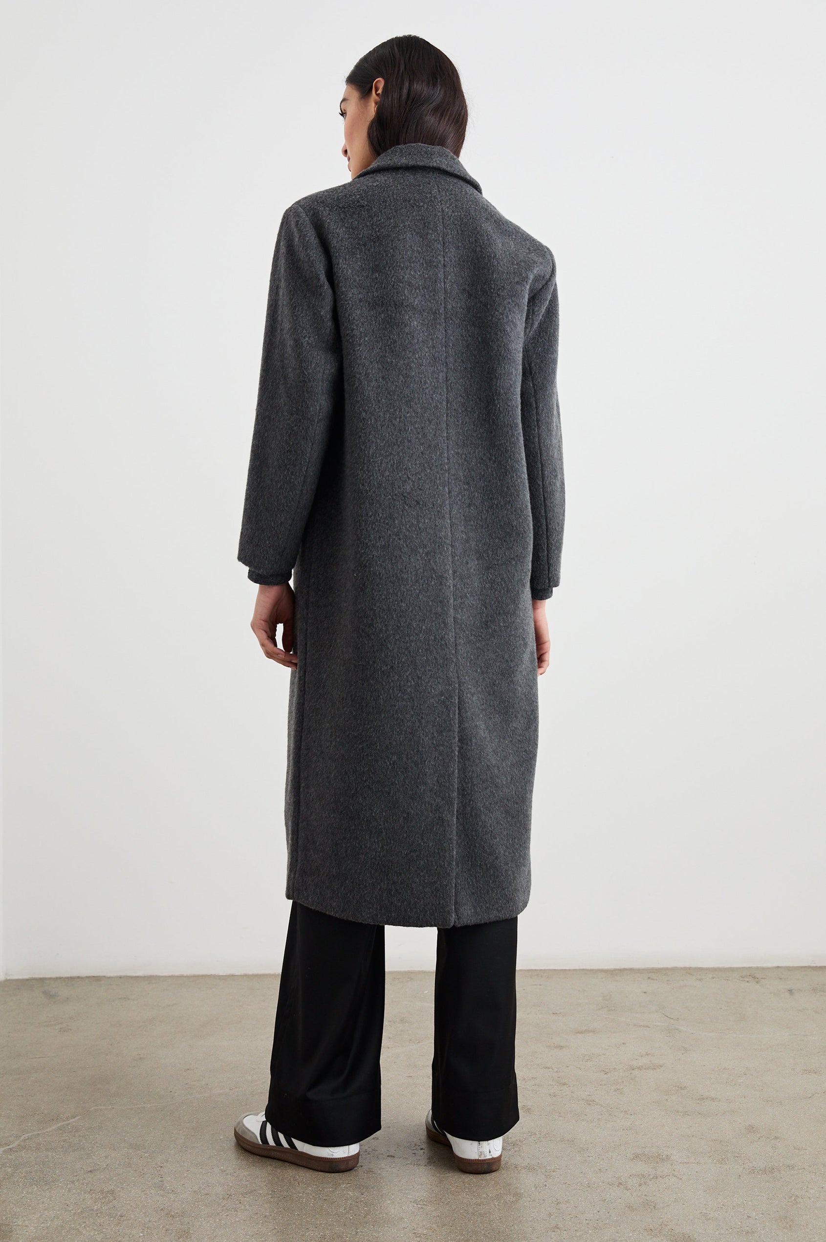 Opera Below-the-Knee Length Coat with V Neck, Three-Button Closure and Two Front Flap Patch Pockets in Charcoal Colorway - Back Full Body View Featured on Model