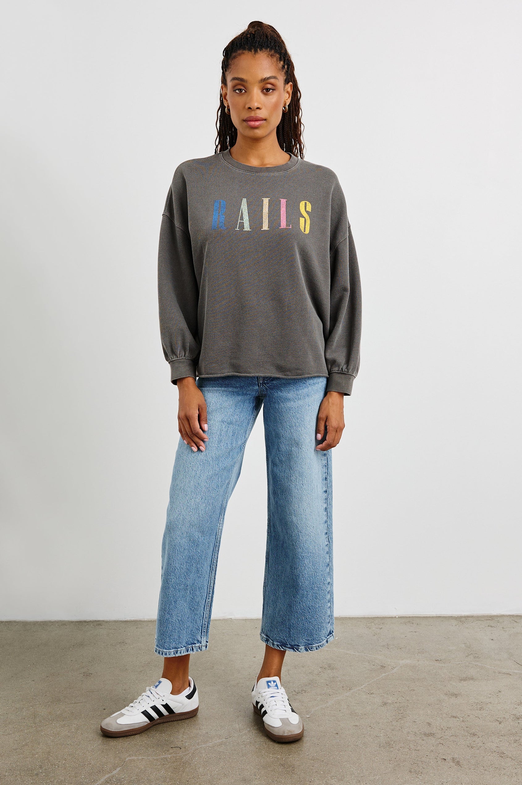 Rails Signature Long-Sleeve Sweatshirt with a Crew Neck, Raw Hem, Shirring Above Cuff, and the Text, Rails, in Vintage Black Colorway, with Multi Colored Text - Front Full Body View Featured on Model