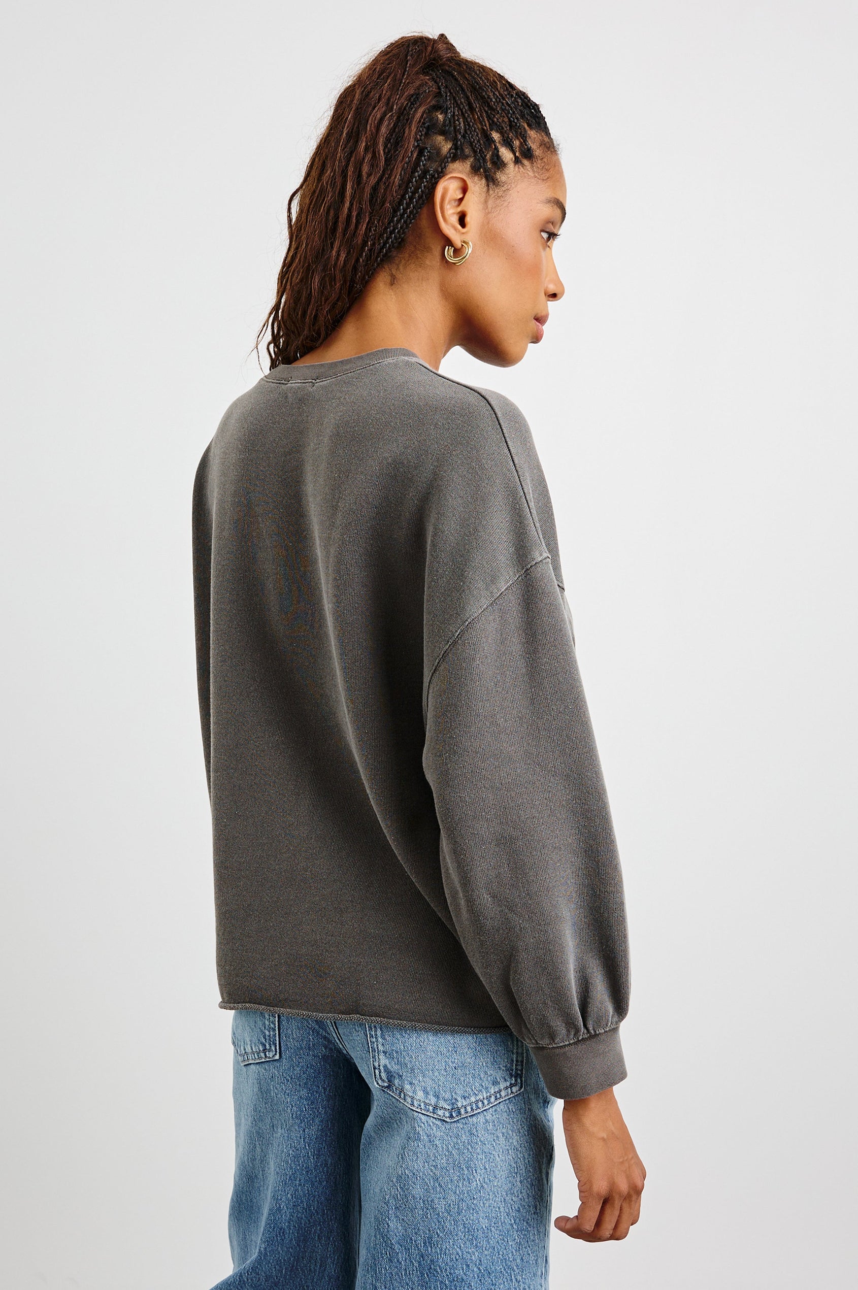 Rails Signature Long-Sleeve Sweatshirt with a Crew Neck, Raw Hem, Shirring Above Cuff, and the Text, Rails, in Vintage Black Colorway, with Multi Colored Text - Back View Featured on Model
