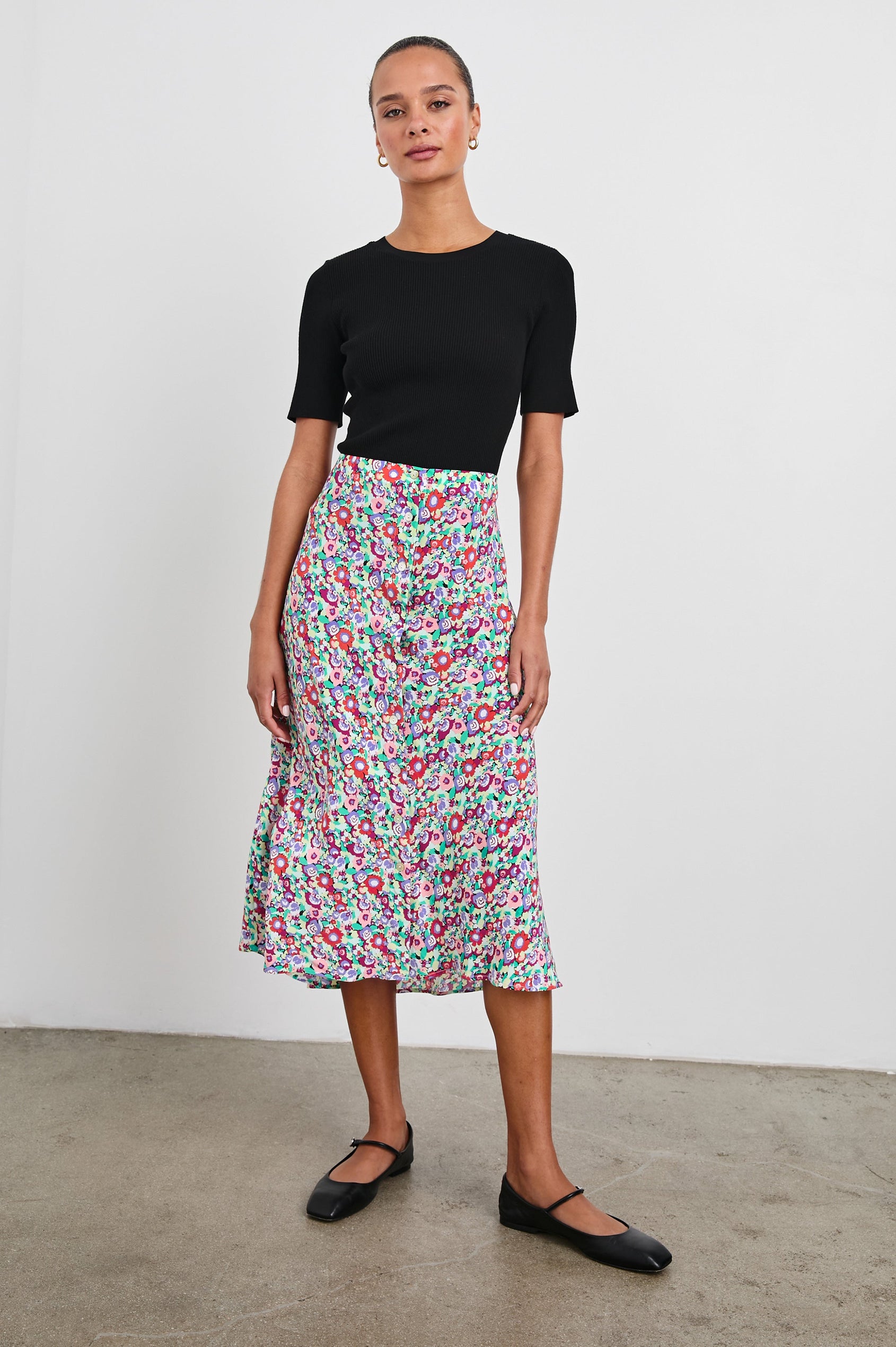 Rosetta Midi Skirt with White Buttons Down the Front in Oversized Multi Floral Colorway, Red, Purple Pinks and Green - Front Full Body View Featured on Model
