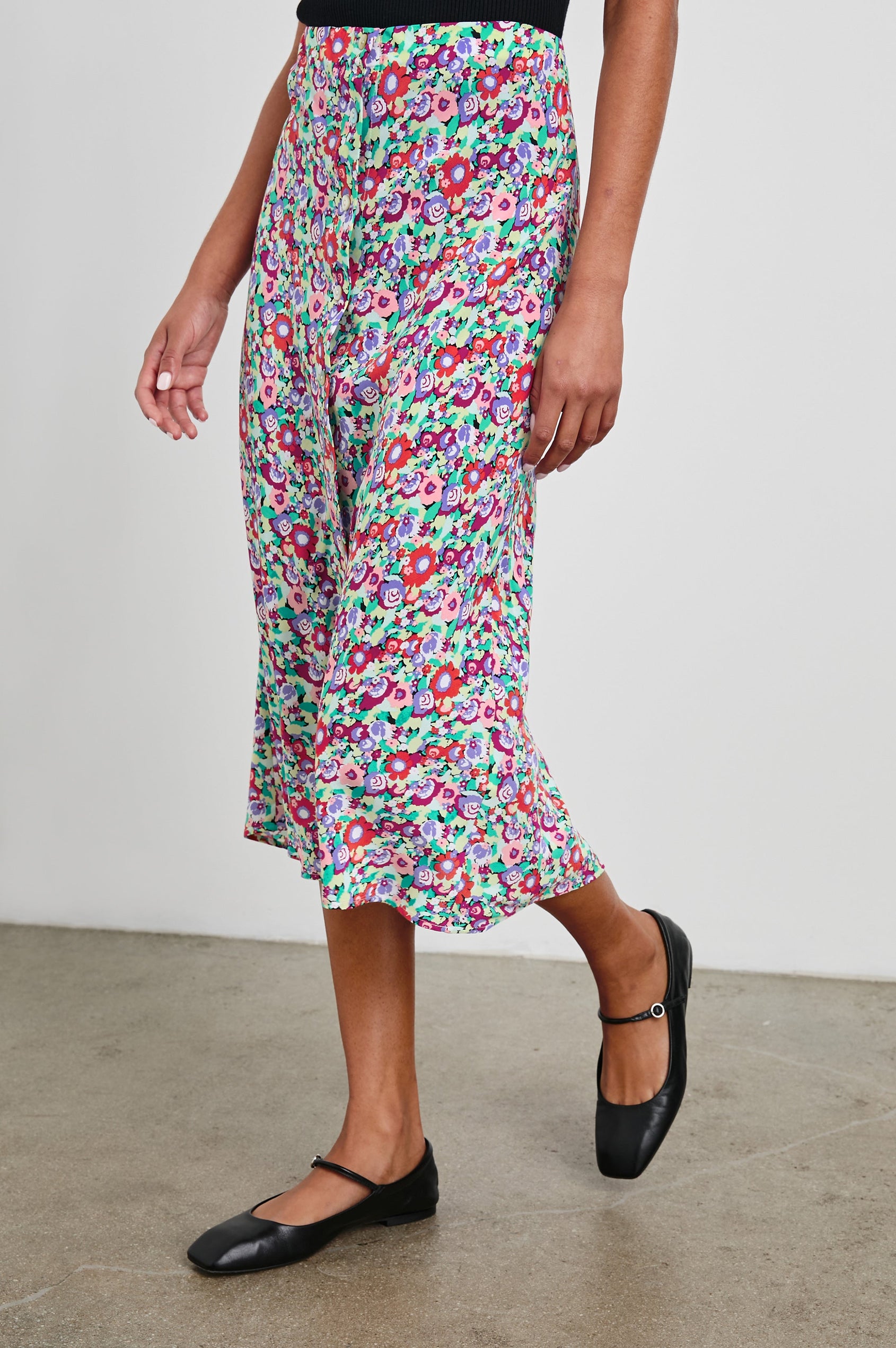 Rosetta Midi Skirt with White Buttons Down the Front in Oversized Multi Floral Colorway, Red, Purple Pinks and Green - Side View Featured on Model