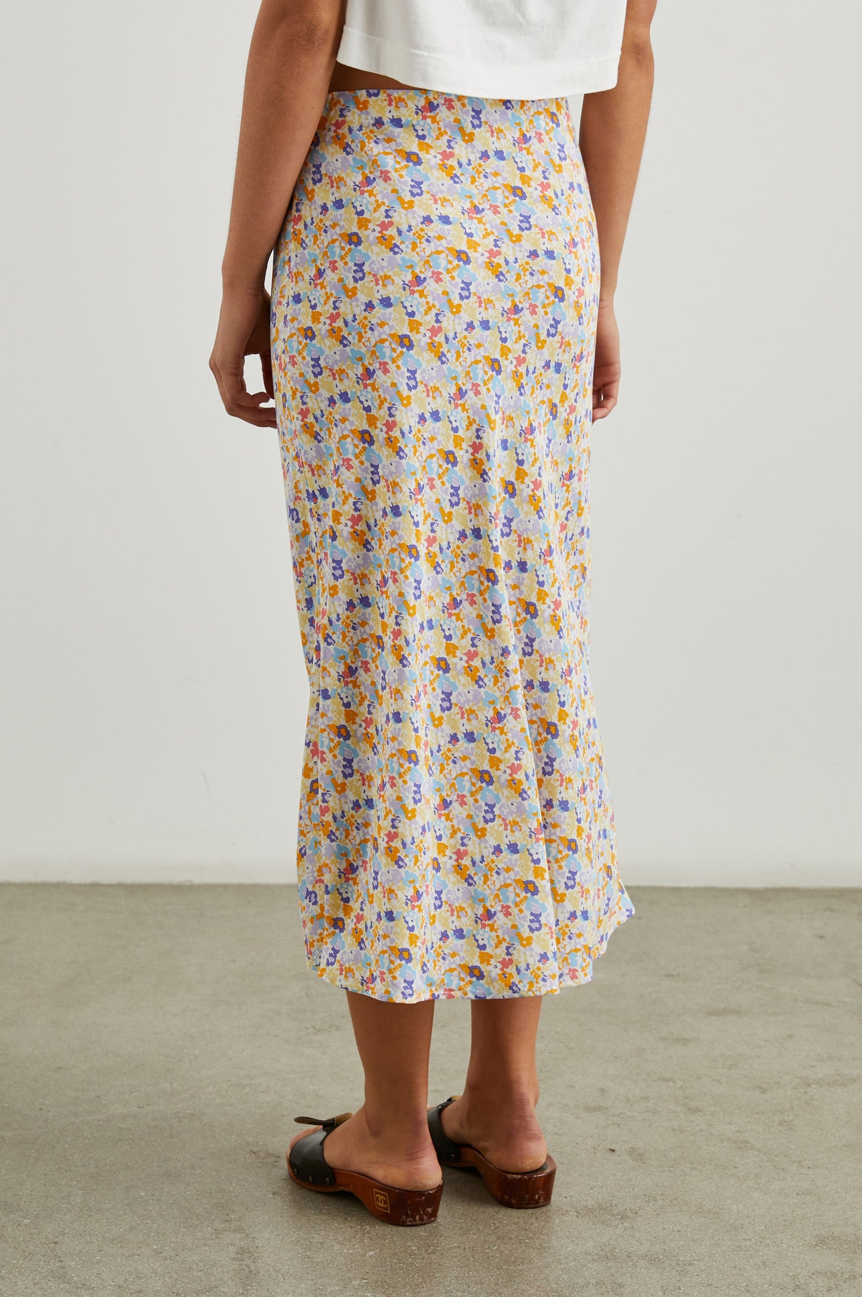 Rosetta Midi Skirt with Buttons Down the Front in Papaya Flowers Colorway, papaya, purple, blue and white flowers - Back View Featured on Model