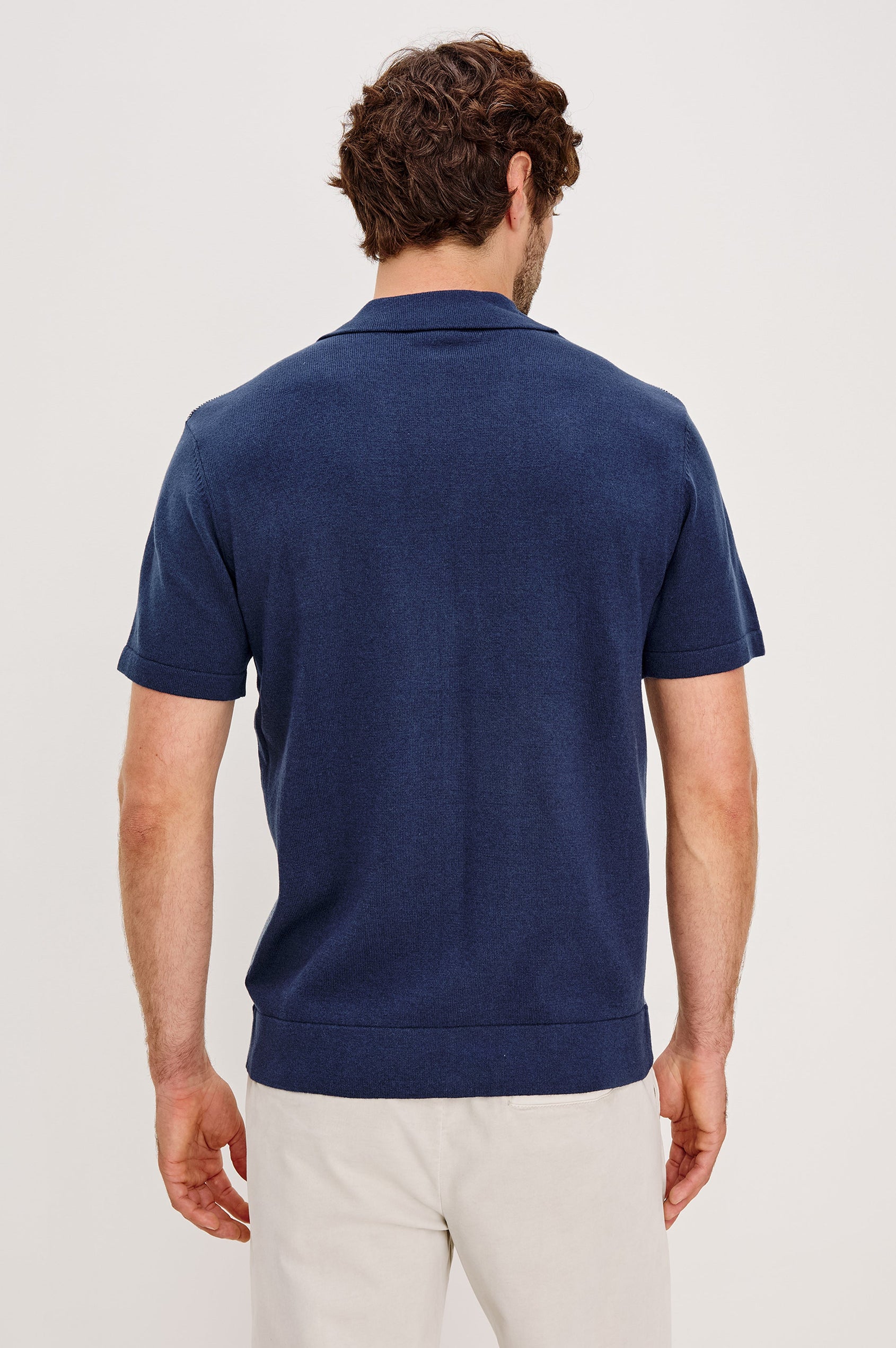Silas short sleeve knit button down shirt with retro front striped design features in Navy Lagoon Stripe - back detail view on model