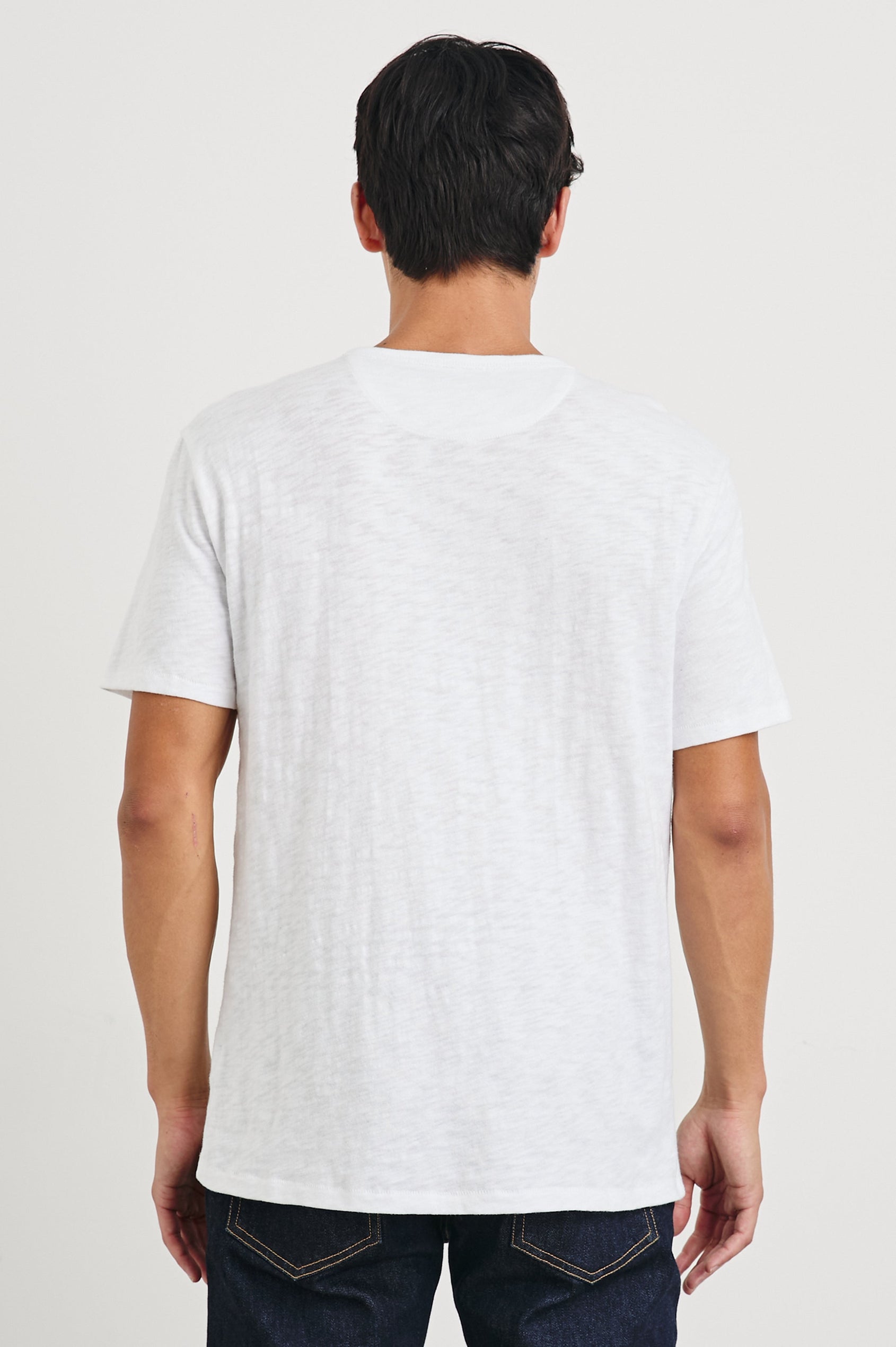 Skipper Short-Sleeve T-shirt with a Crew Neck and a Chest Patch Pocket in White Colorway - Back View Featured on Model