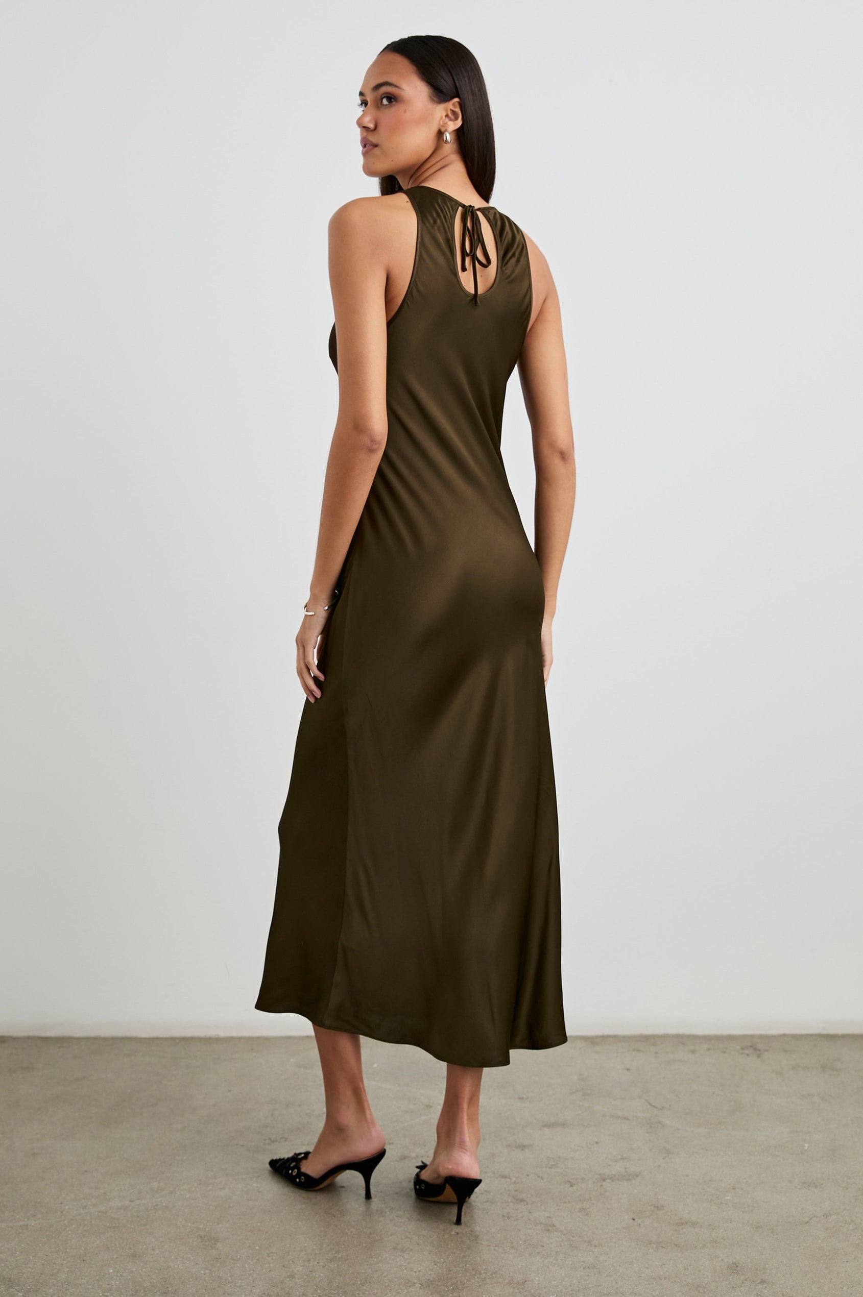 Solene Sleeveless Midi Dress with a Crew Neck and a Tie Keyhole at the Back in Dark Moss Colorway - Back Full Body View Featured on Model
