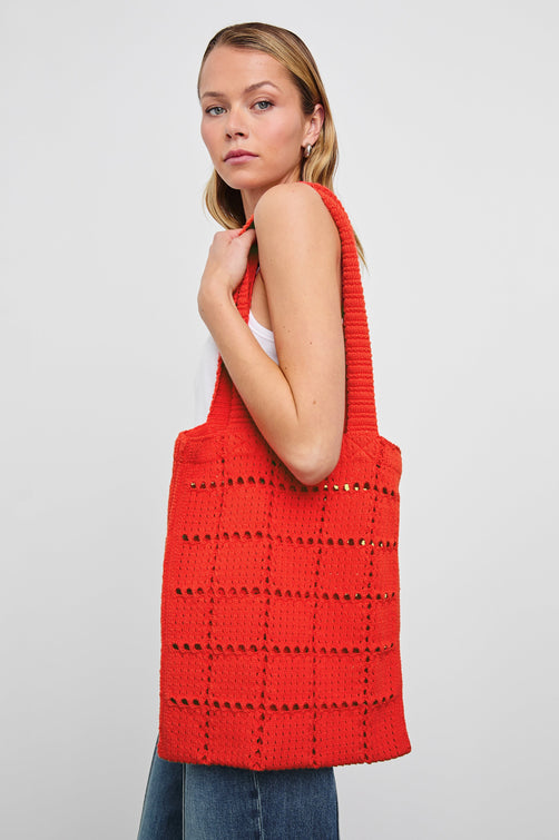 Crochet Rectangular Tote with Patchwork Grid Drop stiches in Cherry Colorway - Side View Featured on Model