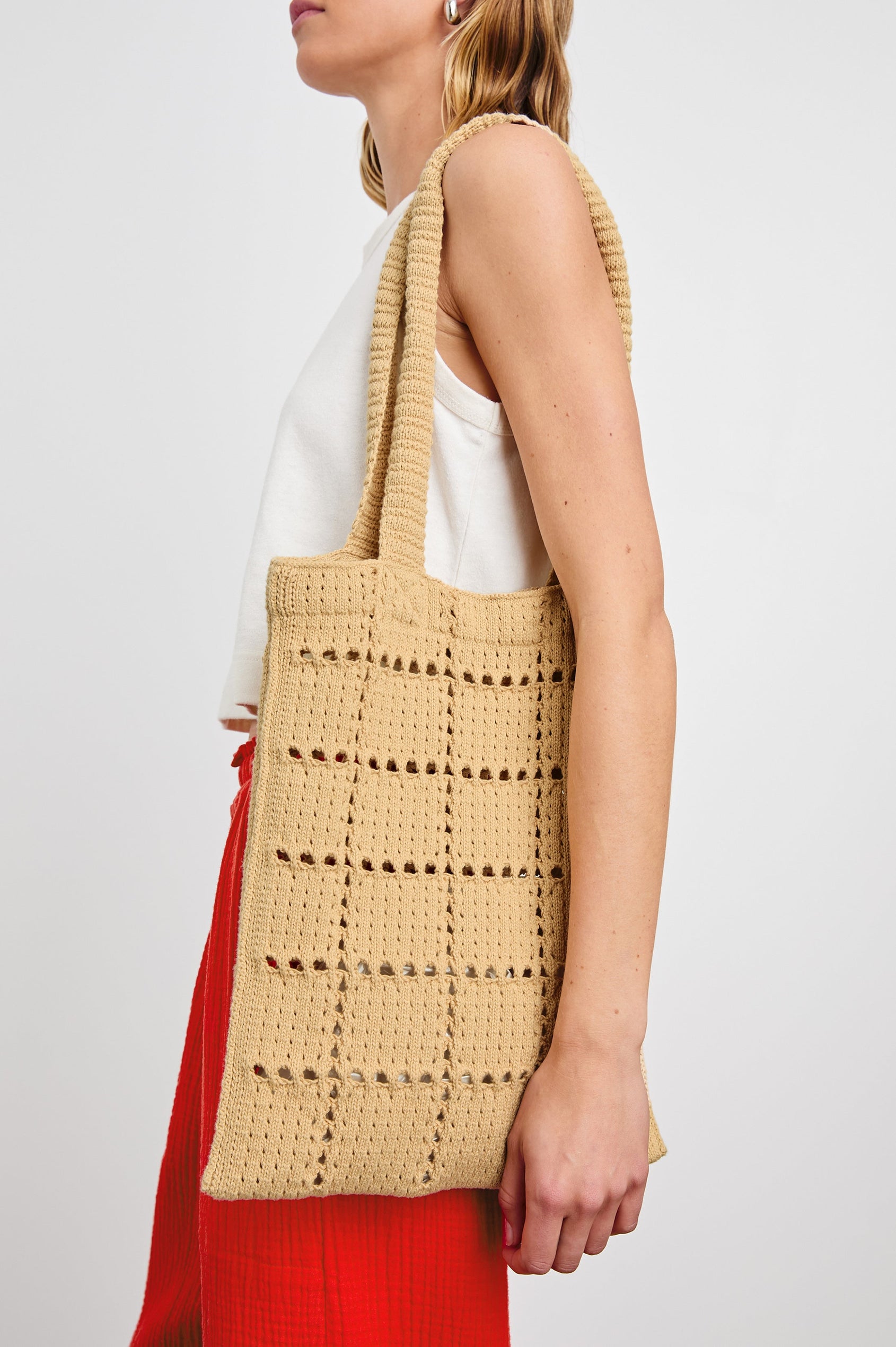Crochet Rectangular Tote with Patchwork Grid Drop stiches in Rattan Colorway - Side View Featured on Model