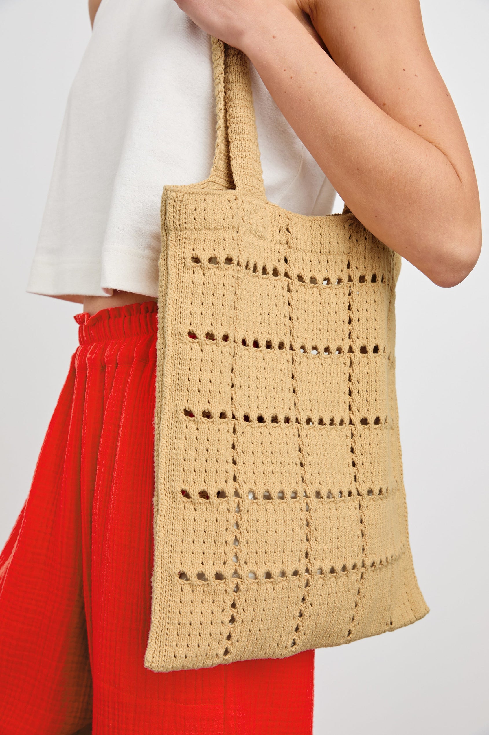 Crochet Rectangular Tote with Patchwork Grid Drop stiches in Rattan Colorway - Side View Featured on Model