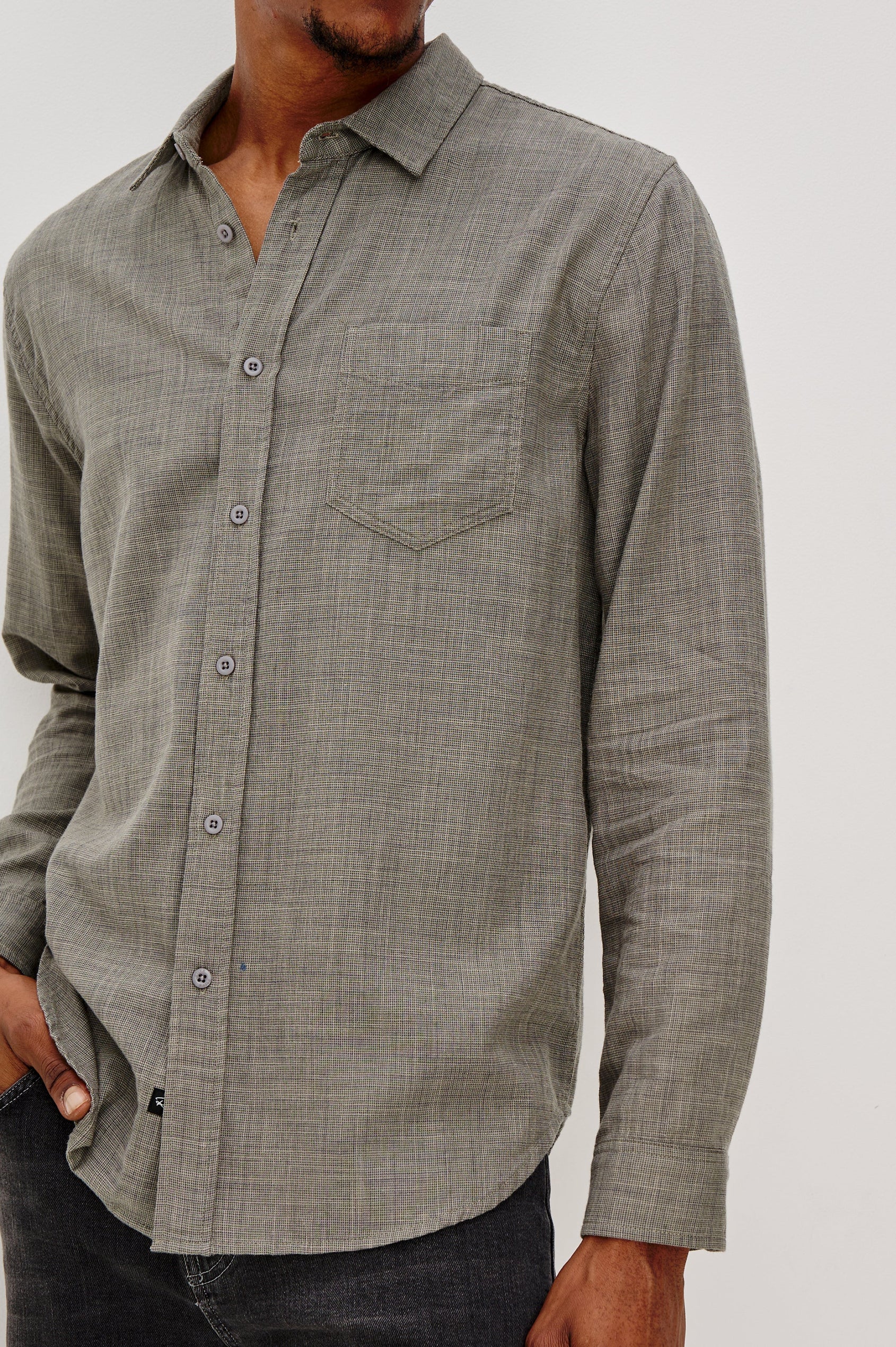 Wyatt Classic Button Up Long Sleeve Shirt with collar and front chest pocket in Spruce Etch, a light green color - front detail view on model