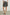 Addison Mini Skirt with a Smocked Waist and a Shorter Over Layer in Ebony Texture Colorway, a Black and White Pattern - Front View Featured on Model