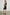 Adaline Ribbed, Sleeveless, Above-the-Knee Dress with Shoulder Straps and a V Neck in Black Colorway - Side Full Body View Featured on Model  