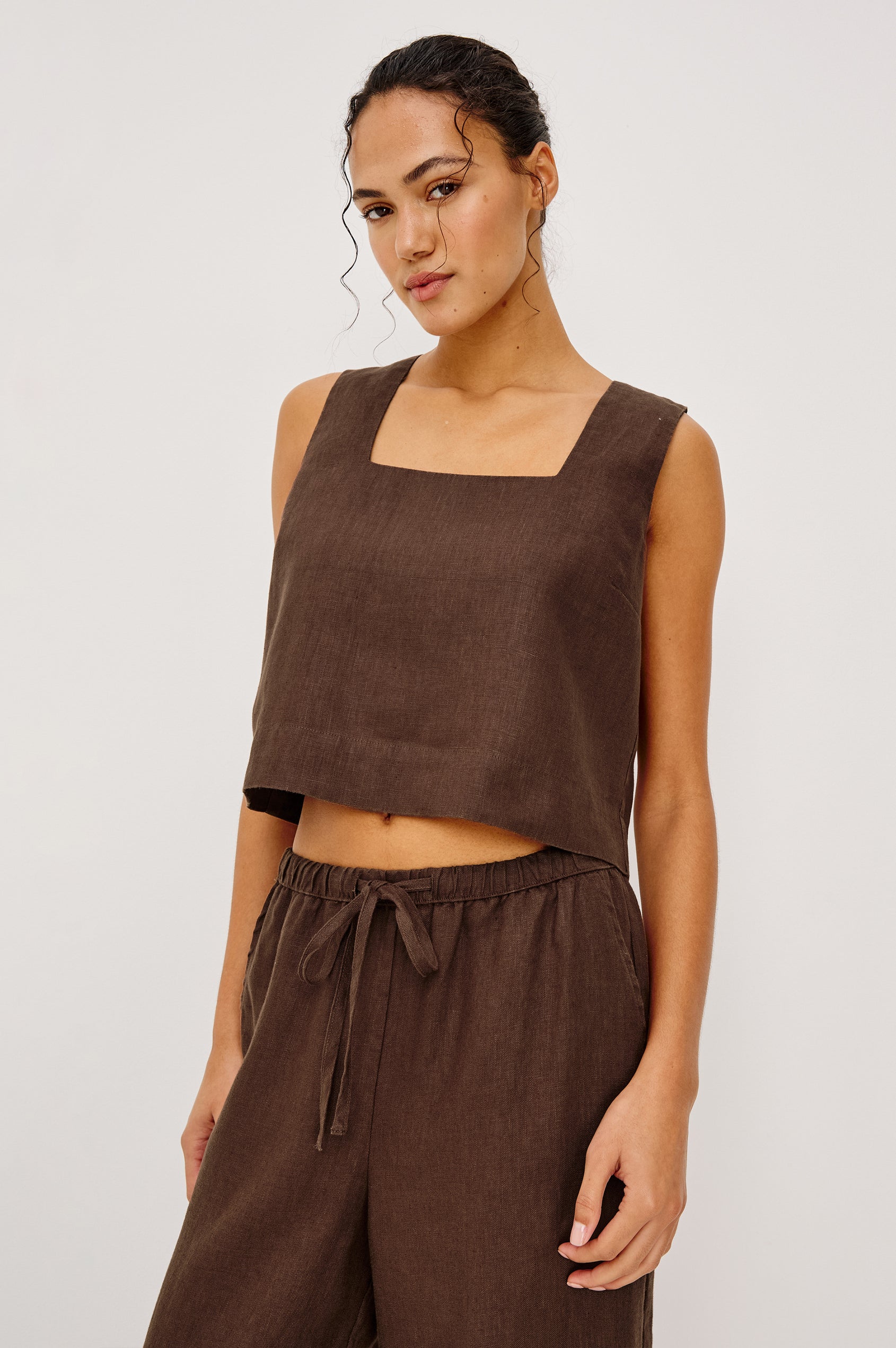 Akira Tank Top in Linen With Square Neckline Wide Fixed Shoulder Straps and Cropped Loose Fit in Espresso Colorway - Upper Body Front VIew Featured on Model