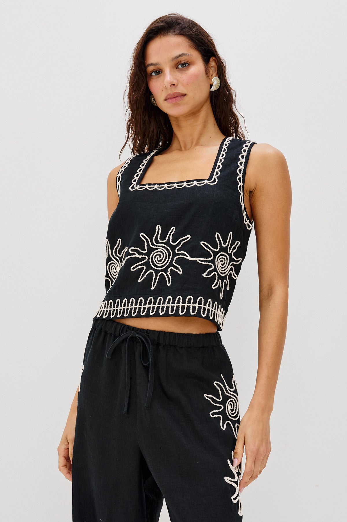 Akira Square Neck Crop Top with Wide Straps in White Contrast Sun Embroidery Colorway. Front View Shown on Model.