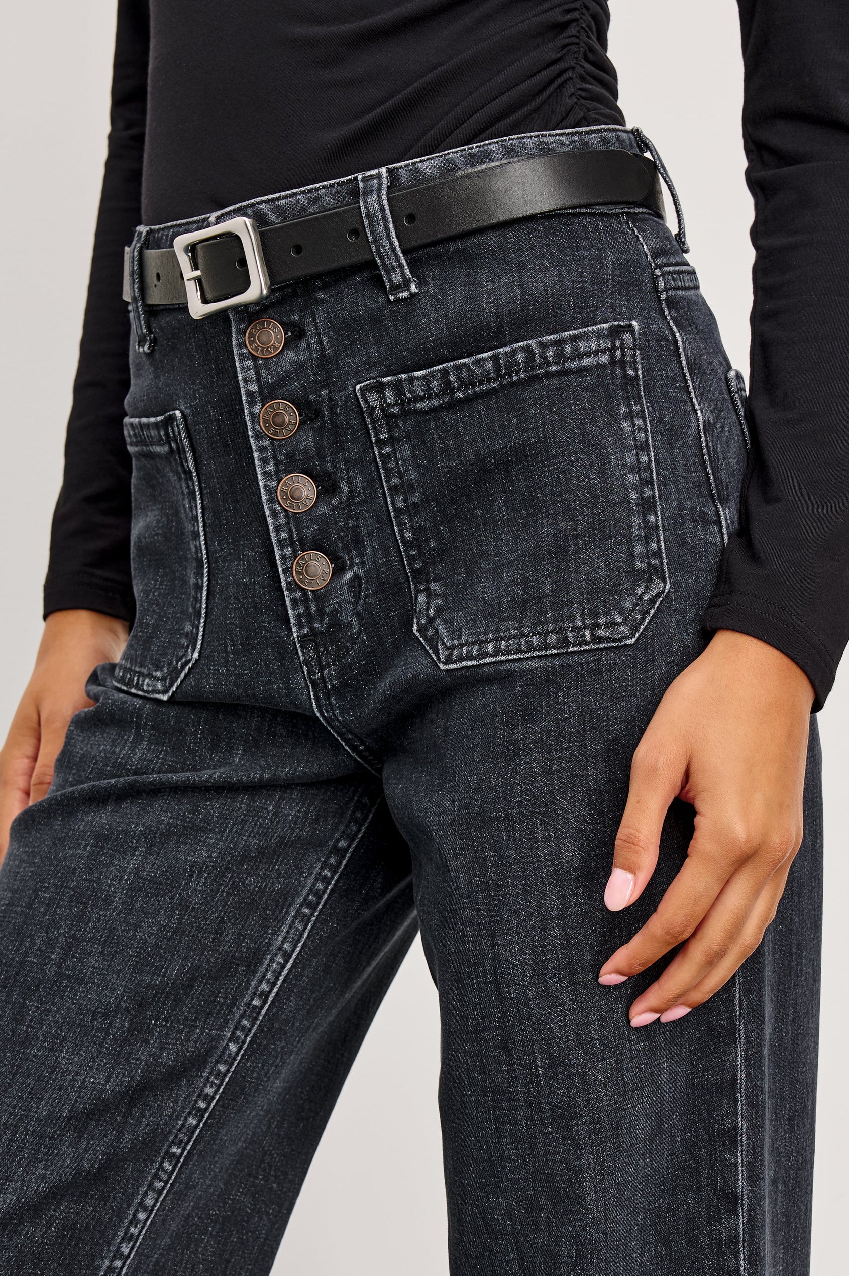 Alamitos high waisted denim trouser with flared leg and front patch pockets in Black Pearl colorway- front detail view on model
