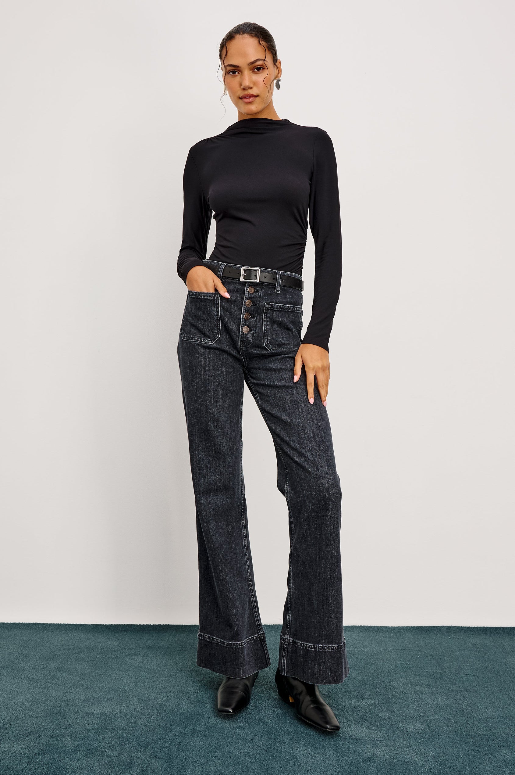 Alamitos high waisted denim trouser with flared leg and front patch pockets in Black Pearl colorway- front full body view on model