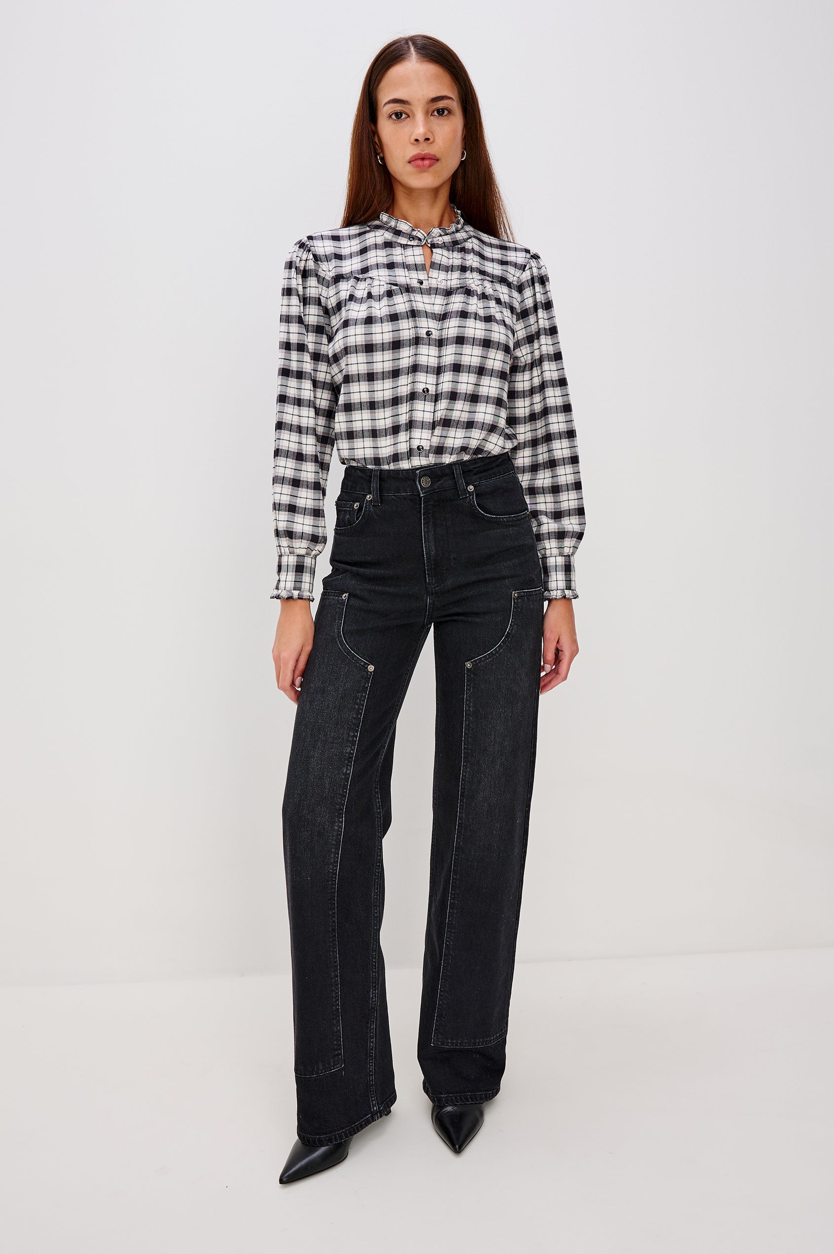 Alanna Long Sleeve Shirt with Snaps Down the Front, a Ruffled Collar, Banded Ruffed Cuffs, and Pleats at the Yoke Seam in Ivory Smoke Onyx Colorway - Full Body Front Tucked View Featured on Model