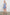 Albany Sleeveless, Mid-Thigh Dress with A Shirred Collar, Drawstring at Waist and a Pleated Hem in Lake View Stripe Colorway, Vertical stripes in blues and white - Front Full Body View Featured on Model