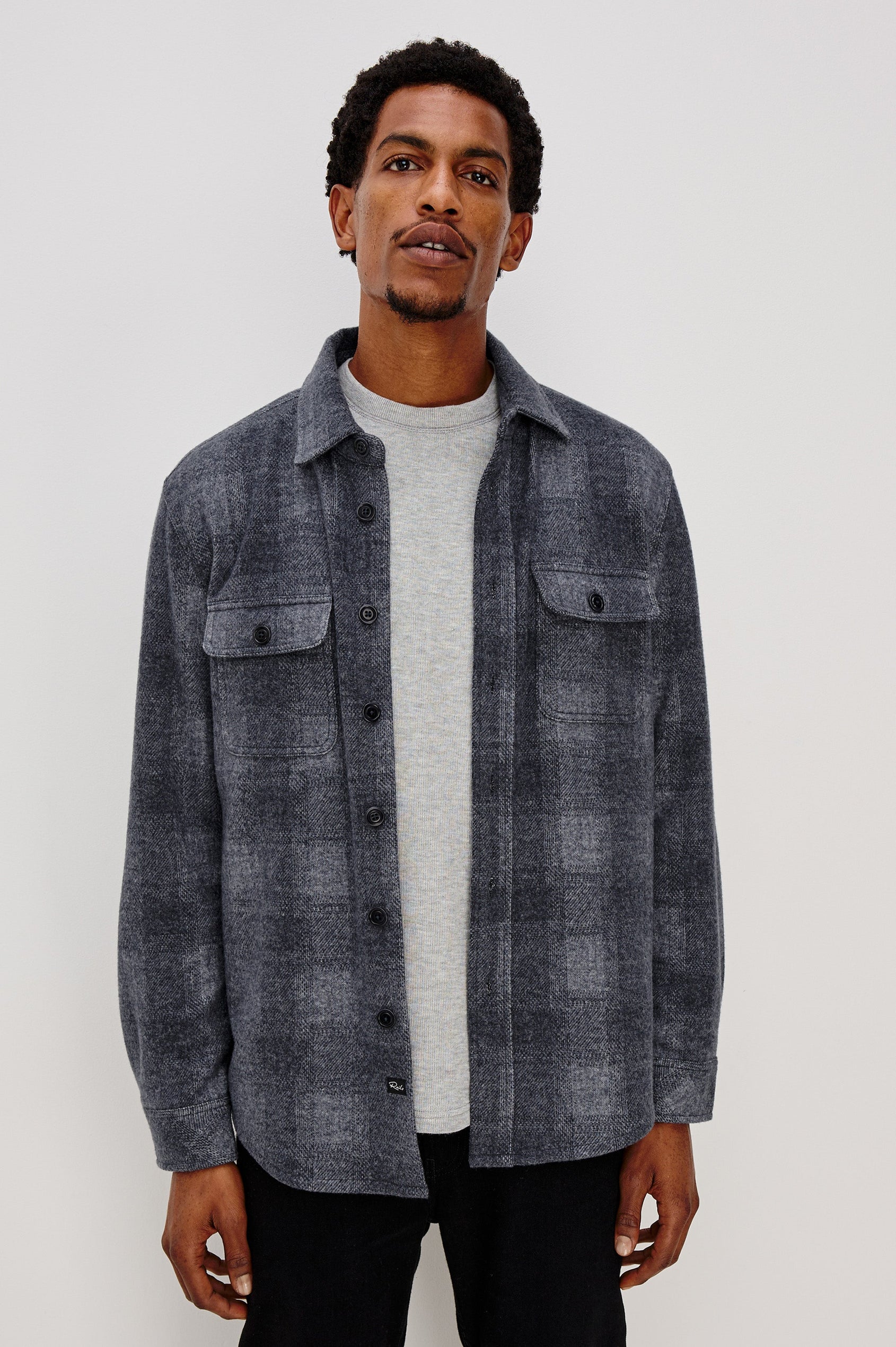 Alder Long-Sleeve Button up with Two Buttoned Chest Flap Pockets in Dusk Eclipse Colorway, a plaid - Front Unbuttoned View Featured on Model
