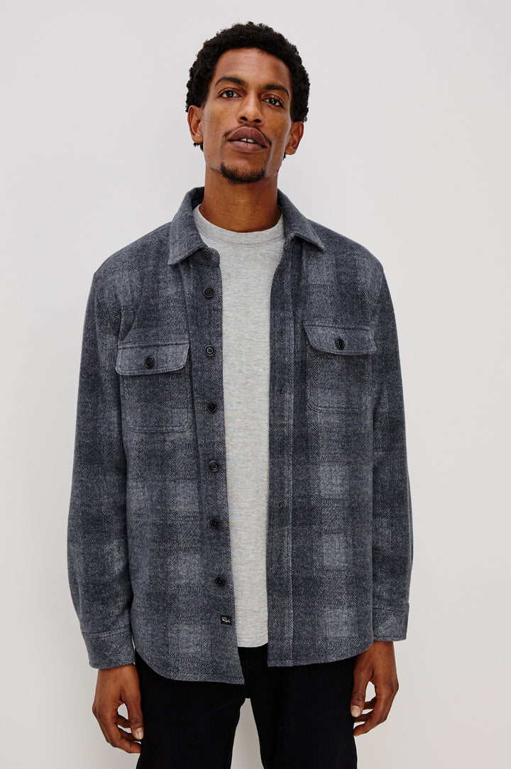 Alder Long-Sleeve Button up with Two Buttoned Chest Flap Pockets in Dusk Eclipse Colorway, a plaid - Front Unbuttoned View Featured on Model