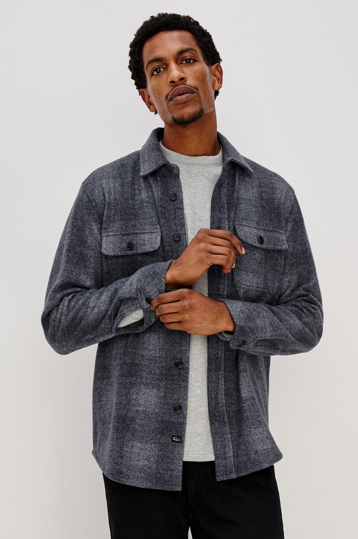 Alder Long-Sleeve Button up with Two Buttoned Chest Flap Pockets in Dusk Eclipse Colorway, a plaid - Front Unbuttoned View Featured on Model