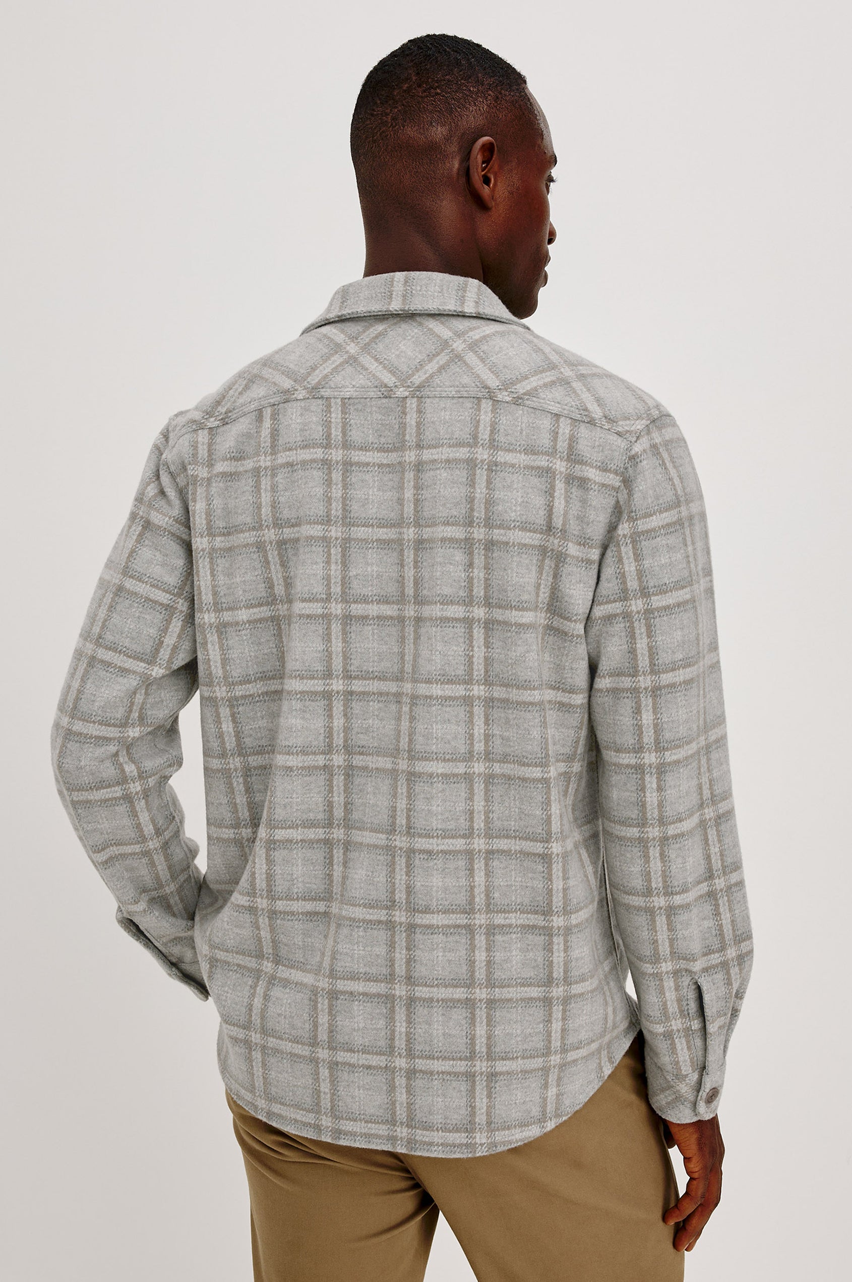 Alder Overshirt in Brushed Flannel With Collar, Button Front, Long Sleeves With Buttoned Cuffs, Back Yoke, Dual Chest Flap Pockets, and Classic Fit in Quarry Mist Heather Colorway - Upper Body Back View Featured on Model