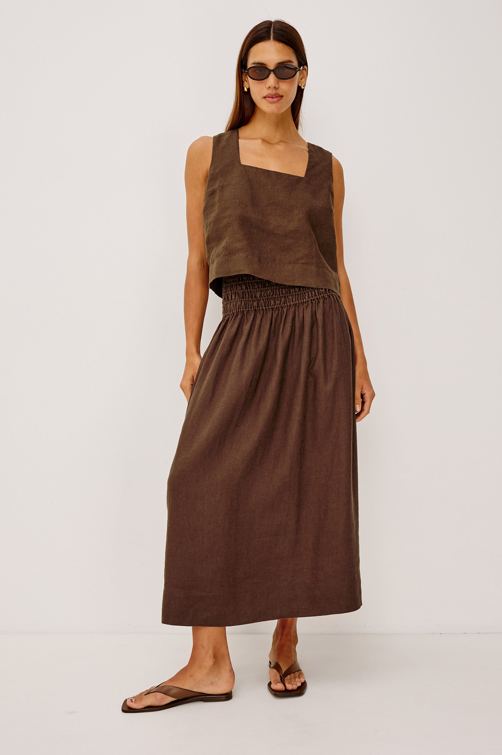 Alessa Midi Skirt in Heavy Linen With Wide Smocked Waistband and A-Line Silhouette in Espresso Colorway - Full Body Front View Featured on Model