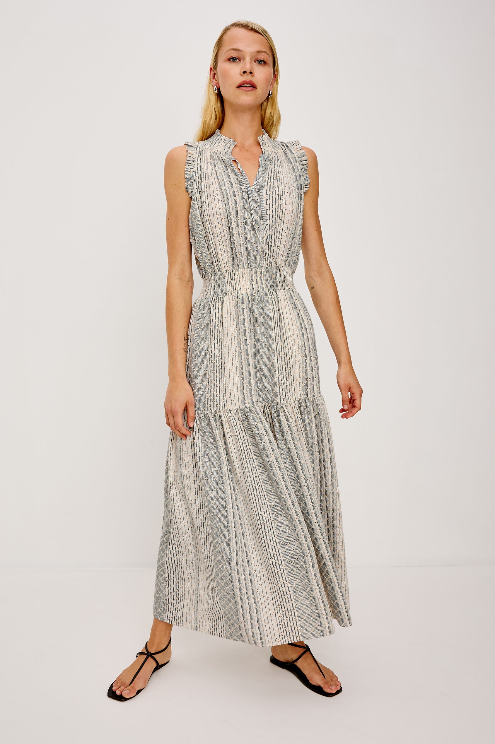 Alessi Maxi Dress in Linen With Smocked Split V-Neckline With Center-Front Ties Diamond Eyelet Detailing All Over Ruffled Trim and Fully Lined Tiered Skirt in Striped Eyelet Colorway - Full Body Front View Featured on Model