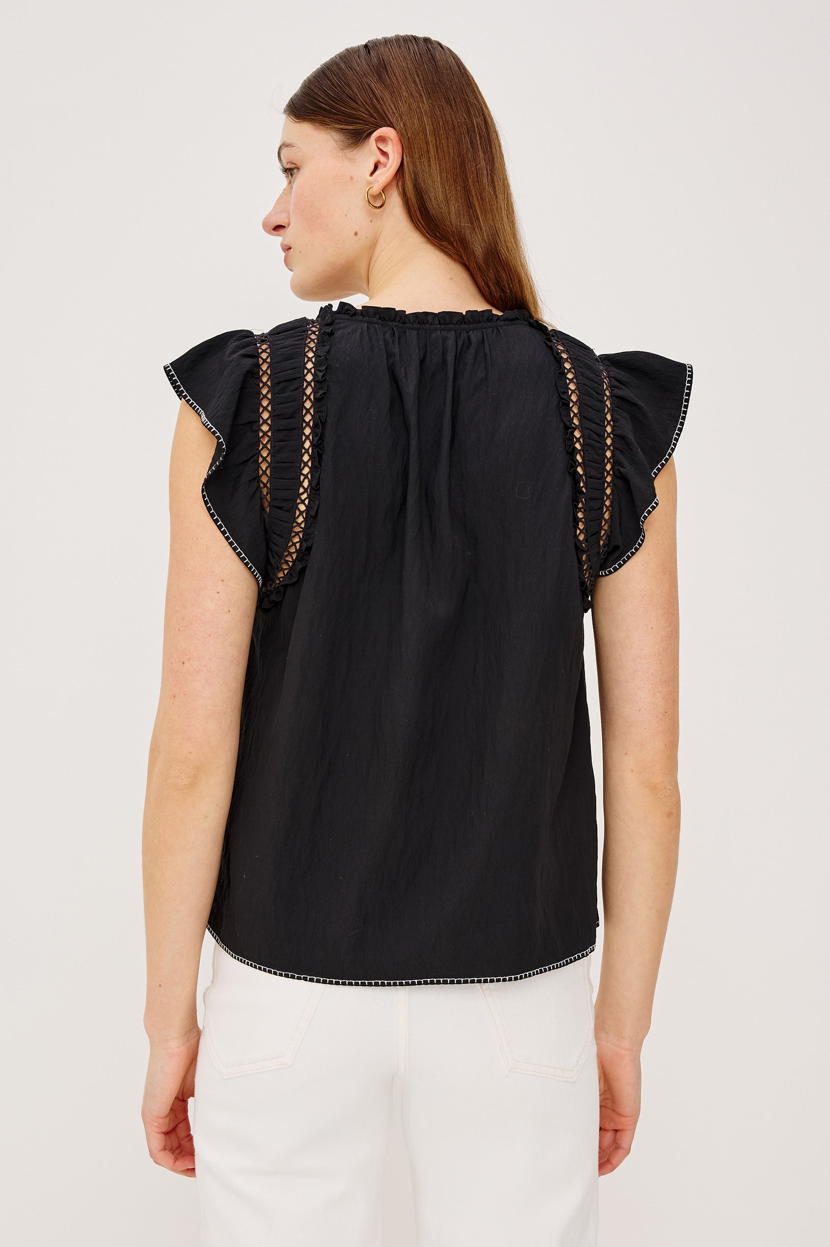 Allea Top in Poplin With Relaxed Fit Split V-Neck. Flutter Sleeves With Contrast Stitcing and Lattice Cutwork in Black Colorway - Upper Body Back View Featured on Model