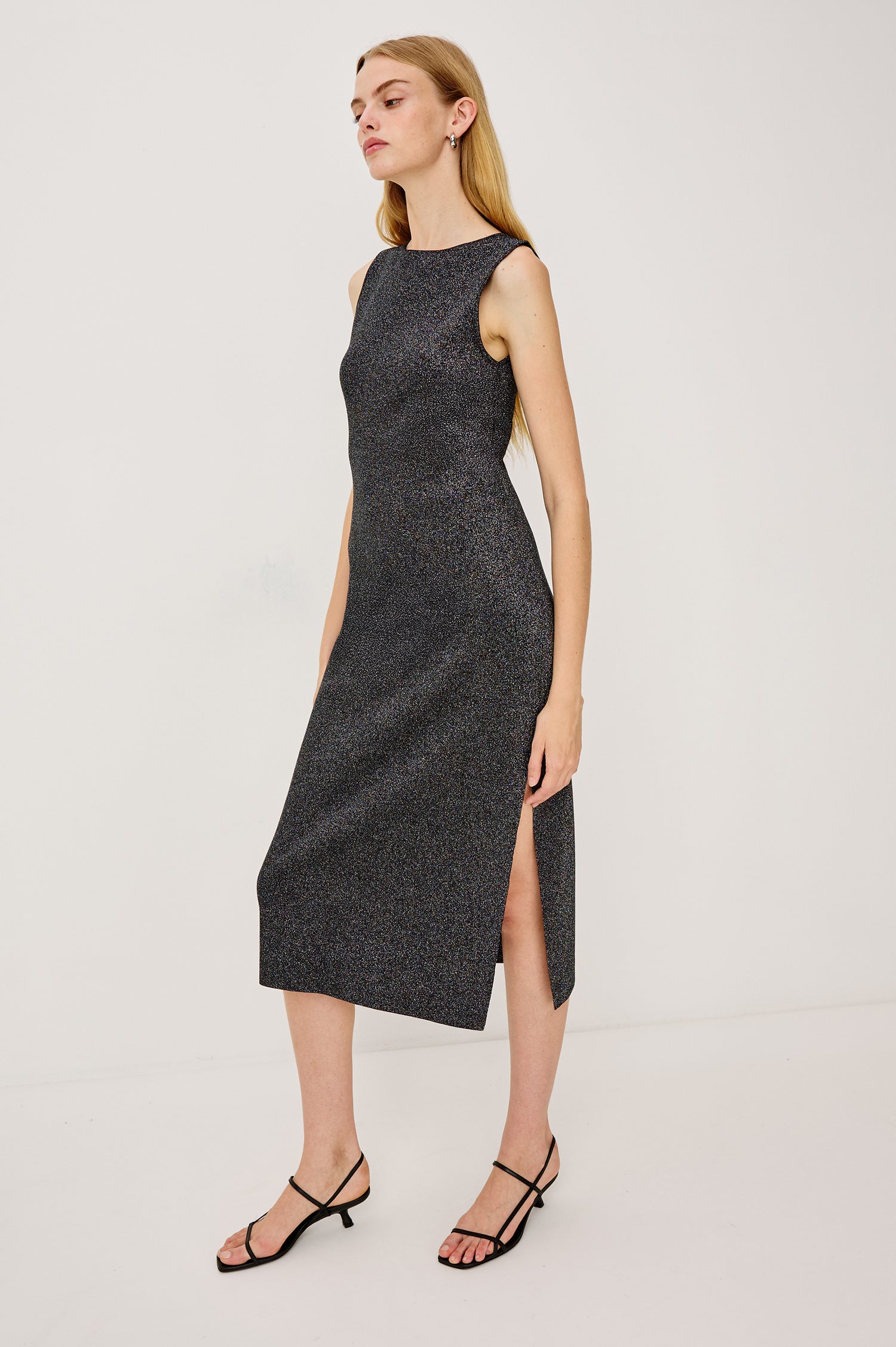 Alora Sleeveless Midi Dress in Fine Ribbed Knit With a Boat Neck and a Mid-Thigh Side Slit in Gunmetal Lurex Colorway - Full Body Side View Featured on Model