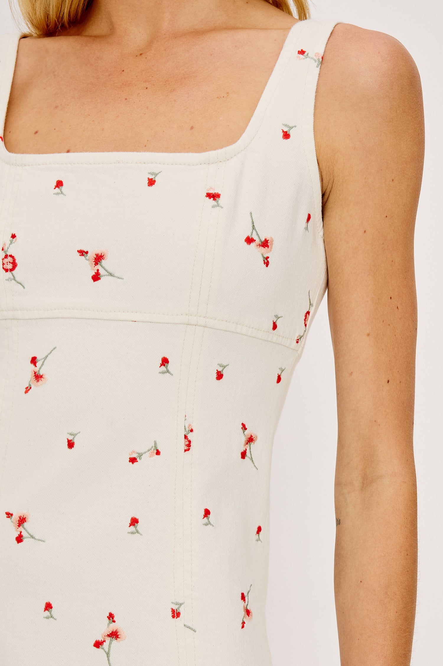 Altadena Mini Dress in Light Stretch Denim With Sleeveless Square Neckline and Back Zip Closure in Ecru Romantic Floral Colorway - Upper Body Front Close Up View Featured on Model
