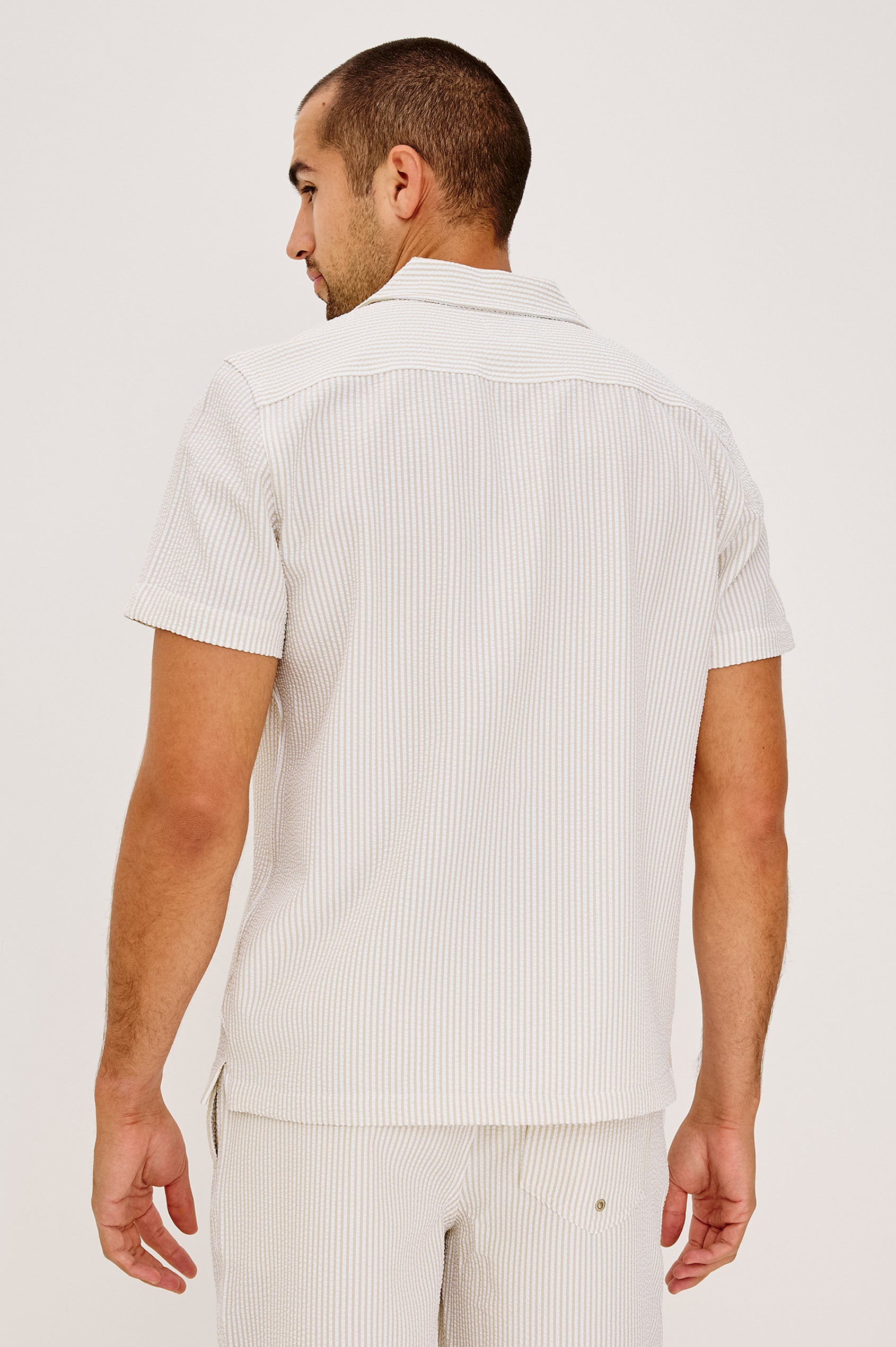 Amalfi Button-Up Short Sleeve Shirt in Lightweight Stretch Linen-Blend With a Notched Collar and Classic Fit in Khaki White Seersucker - Upper Body Back View Featured on Model