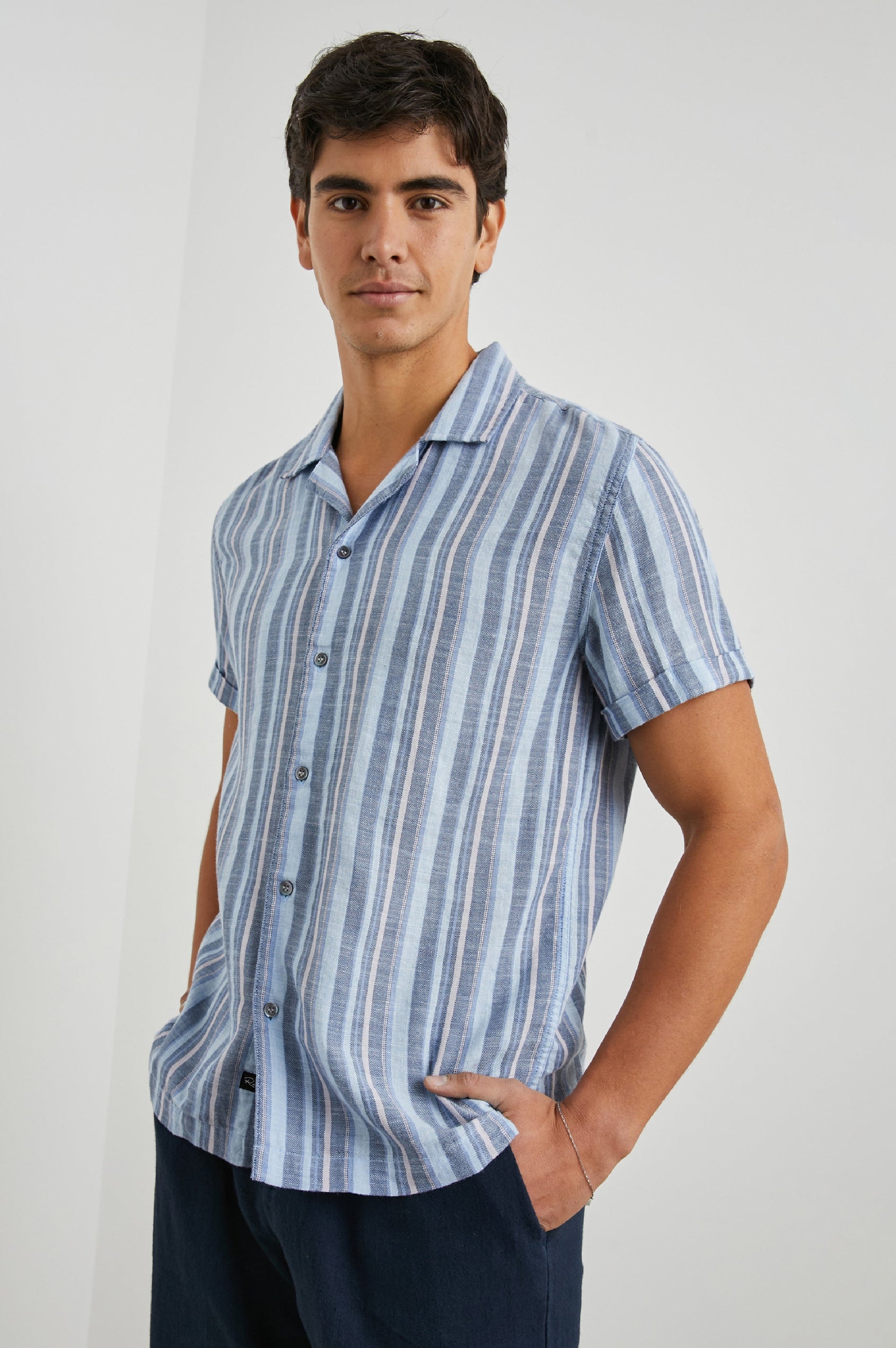 Amalfi Short-Sleeve Button Up in Powder Cobalt Stripe Colorway, vertical stripes in powder, cobalt and petal - Front View Featured on Model