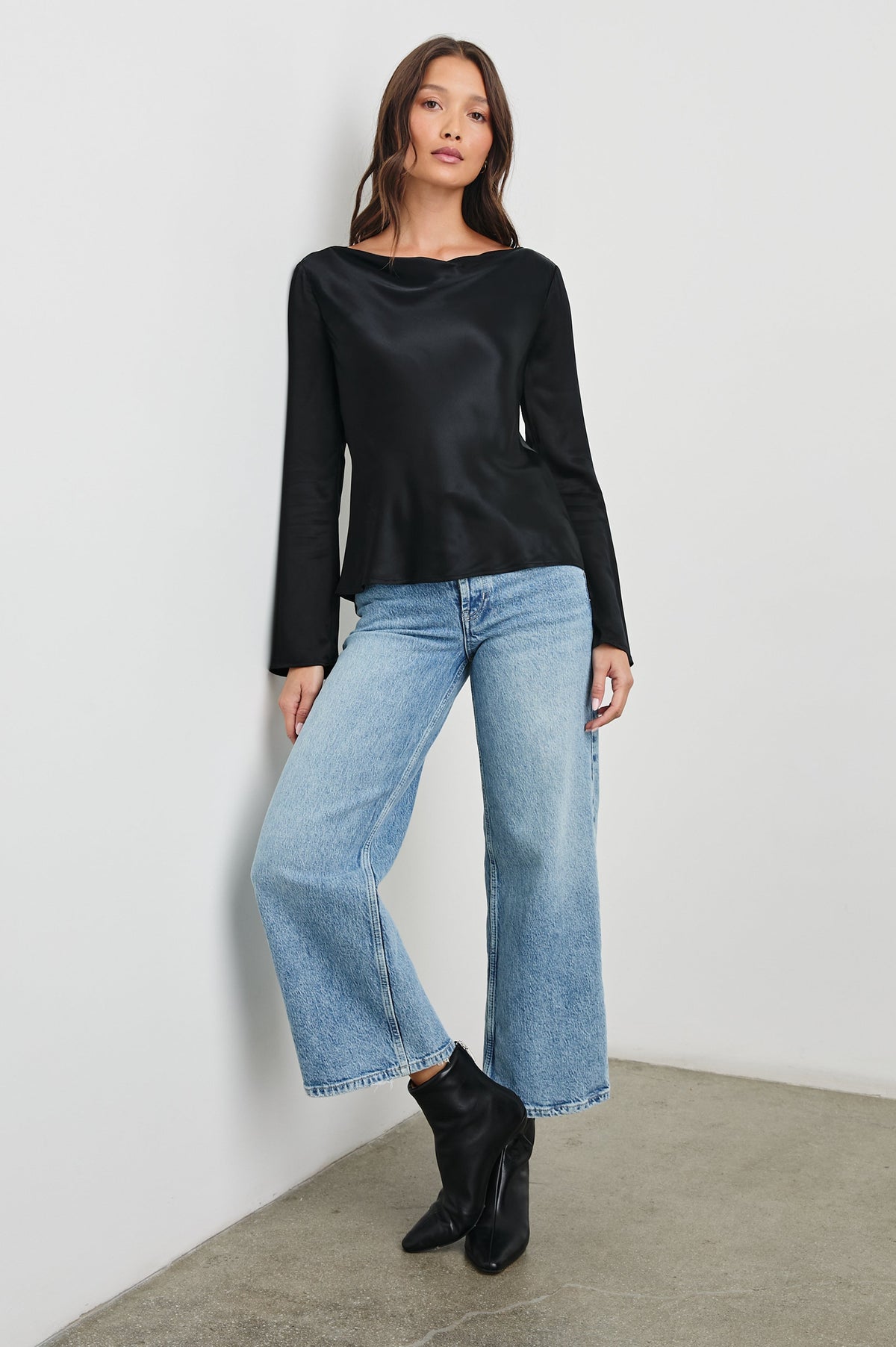 Amari Long-Sleeve Top with Boat Neckline and Flared Sleeves in Black Colorway - Front Full Body View Featured on Model