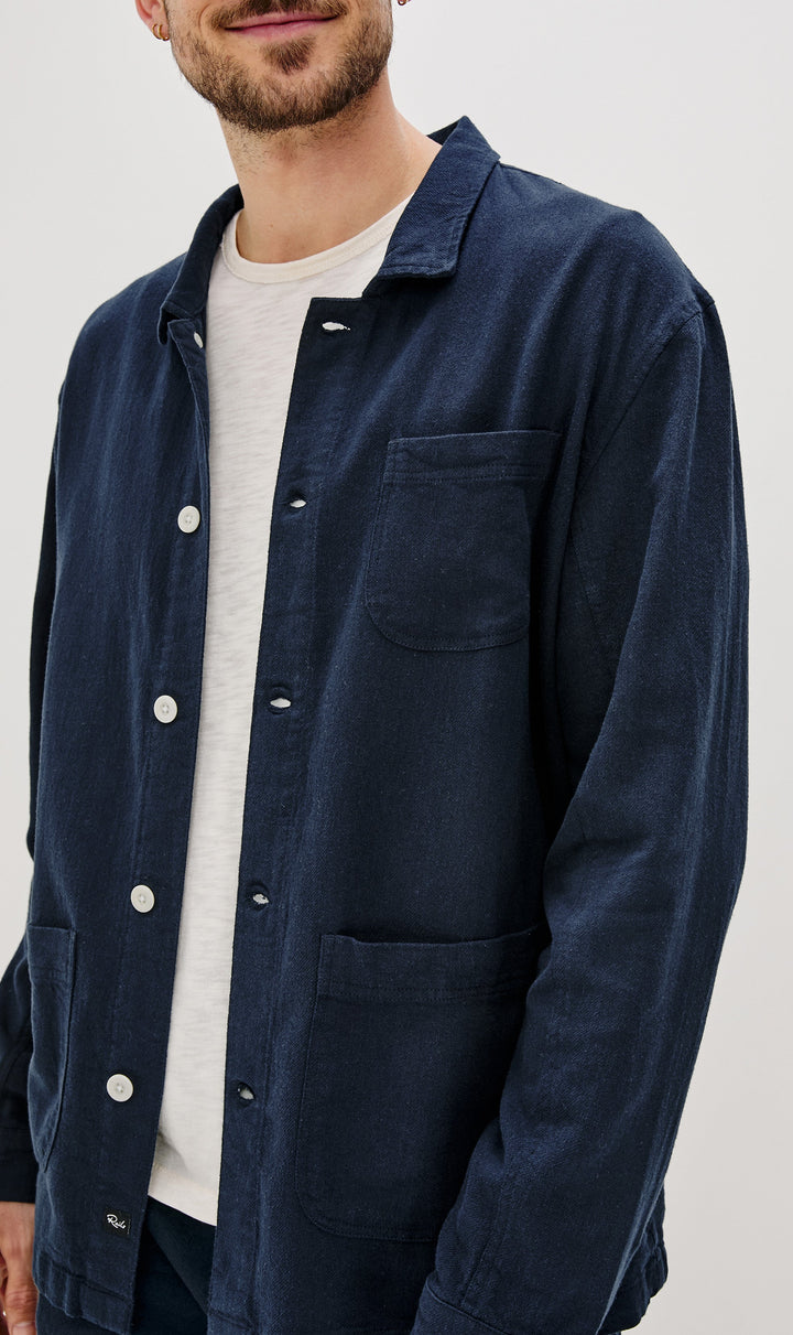 Ambrose Jacket with Button Closure and Two Front Patch Pockets and a Chest Patch Pocket in Deep Meridian Colorway - Front View Featured on Model