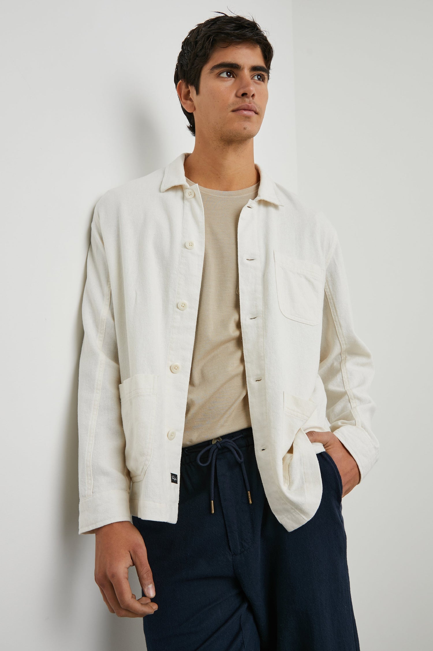 Ambrose Jacket with Button Closure and Two Front Patch Pockets and a Chest Patch Pocket in Ecru Colorway - Front View Featured on Model