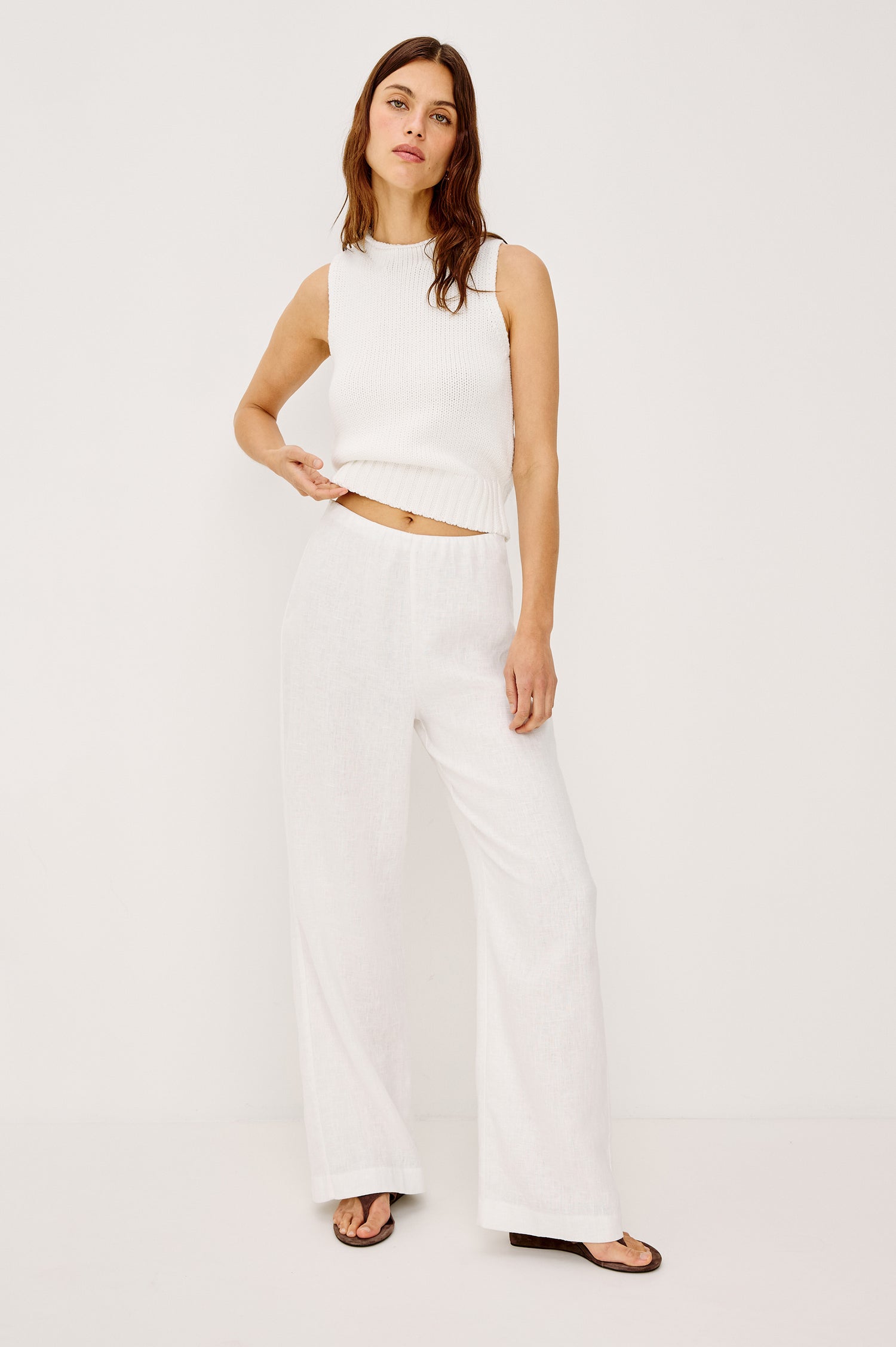 Andrine Pant in Heavy Linen With High-Waisted Fit, Straight Legs, Unlined, Side On-Seam Pockets, Side Zip Closure in White Colorway - Full Body Front View Featured on Model