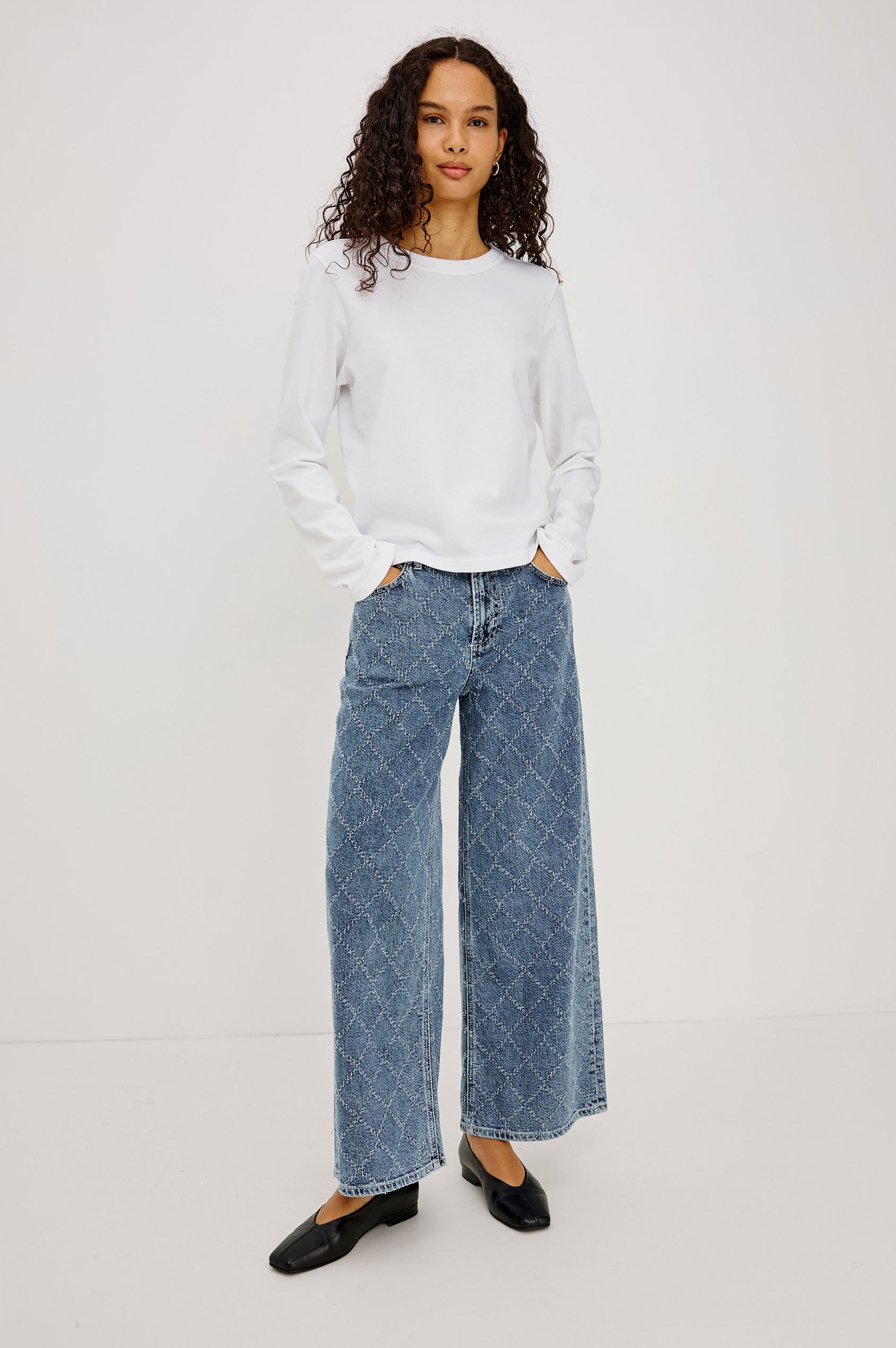 Angeleno Wide Leg Crop Jean in Rigid Drapey Denim With Mid-Rise Cropped Fit, 5-Pockets, Self-Tie Shoelace Belt, Frayed Waistband, and Zip-and-Hook Closure in Dark Diamond Distress Colorway - Full Body Front View Featured on Model