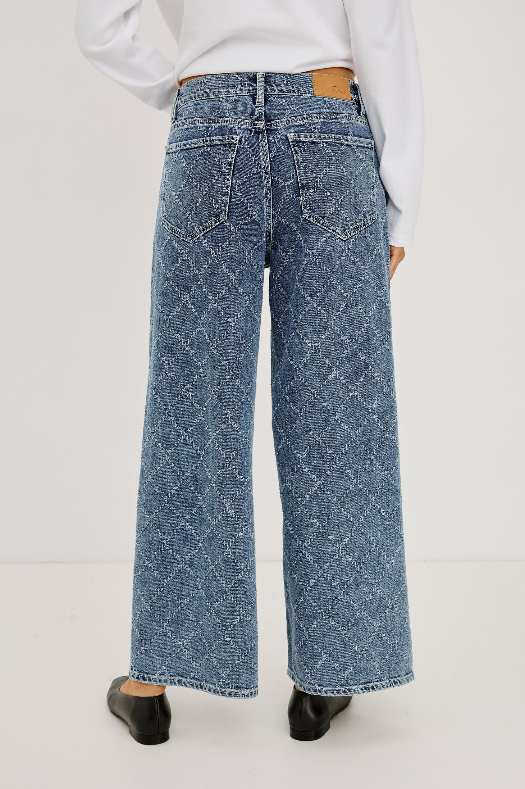 Angeleno Wide Leg Crop Jean in Rigid Drapey Denim With Mid-Rise Cropped Fit, 5-Pockets, Self-Tie Shoelace Belt, Frayed Waistband, and Zip-and-Hook Closure in Dark Diamond Distress Colorway - Lower Body Back View Featured on Model