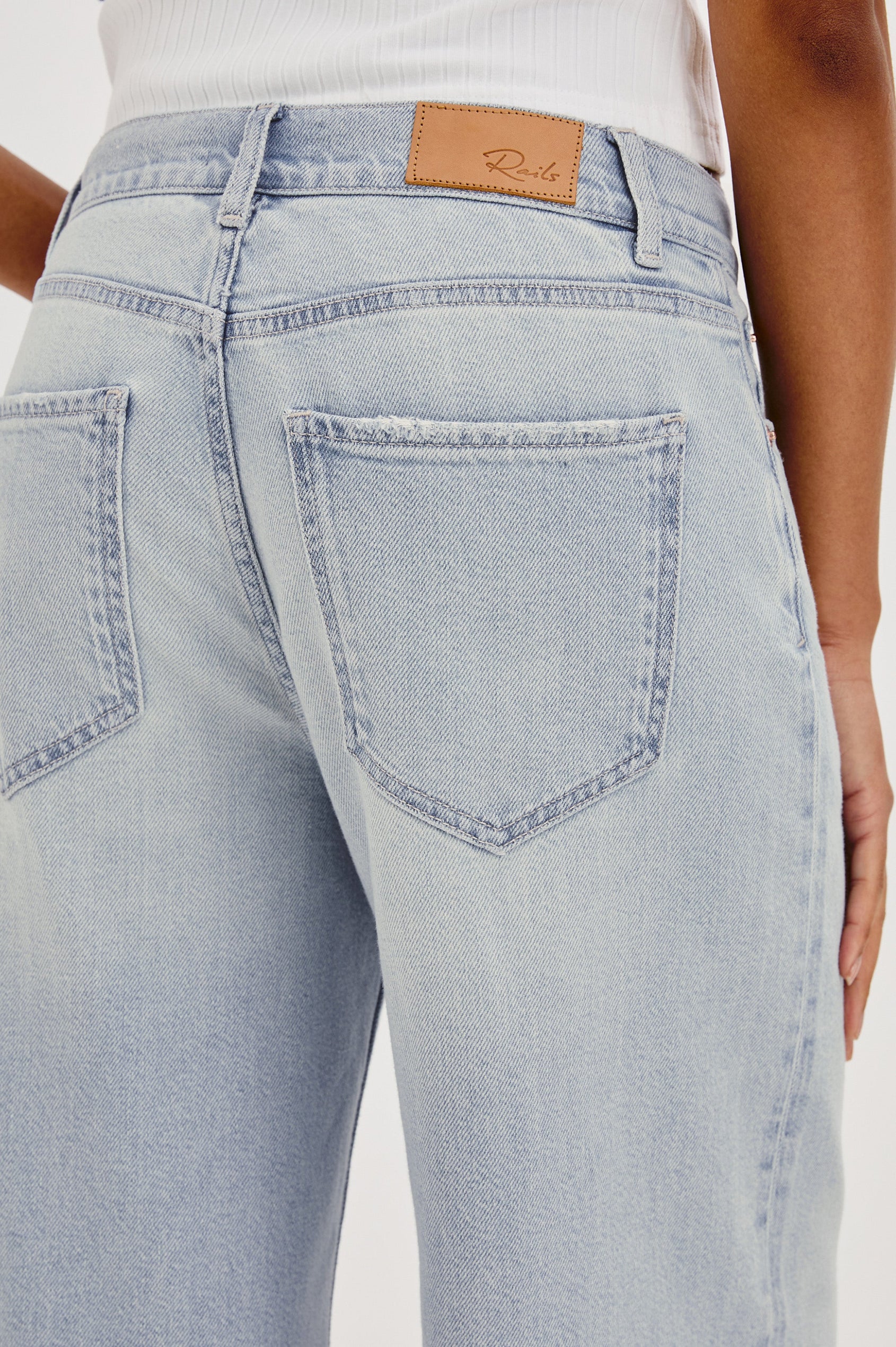 Angeleno Crop Denim Pant, Wide Leg, Five Pocket Zip Fly with a White Drawstring Tie at Waist in Light Wash Scuba Colorway. Back View Shown on Model.