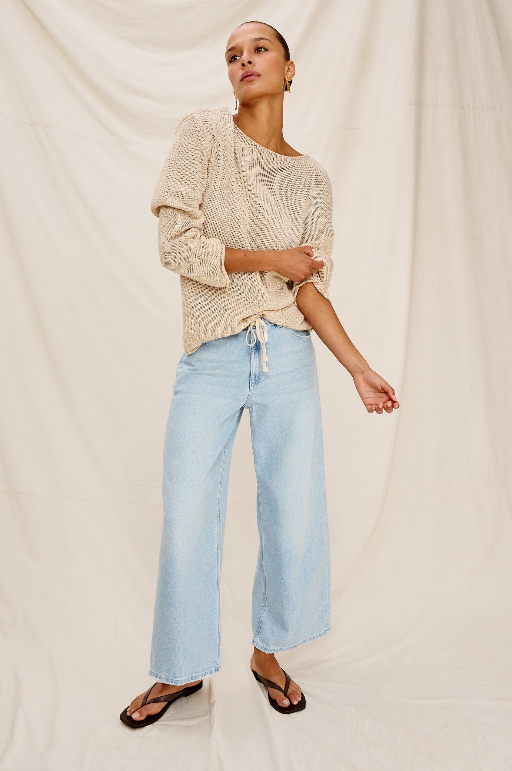 Angeleno Crop Denim Pant, Wide Leg, Five Pocket Zip Fly with a White Drawstring Tie at Waist in Light Wash Scuba Colorway. Front View Shown on Model.