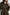 Anina Long-Sleeve Midi Dress with Buttons Down the Front, a Collar, Button Cuffs, and a Cord Belt in Dark Moss Colorway - Front View Featured on Seated Model