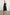 Anita Sleeveless, Midi Dress with an Asymmetrical Neckline and a Cinched Waist in Black Colorway - Front Full Body View Featured on Model