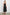 Anita Sleeveless, Midi Dress with an Asymmetrical Neckline and a Cinched Waist in Black Colorway - Back Full Body View Featured on Model