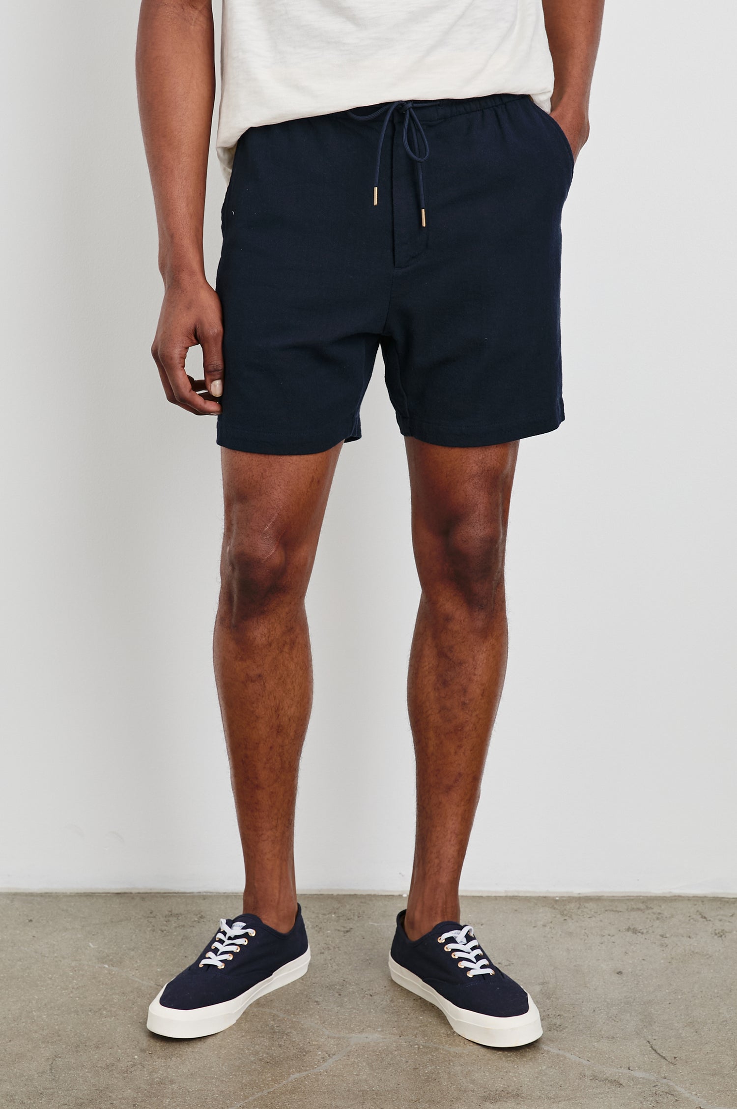 Archer Short in Cotton-Linen Blend With Relaxed Fit, Elastic Drawstring Waist, Front Zip Fly, Side Pockets, and Back Welt Pocket in Deep Meridian Colorway - Lower Body Front View Featured on Model