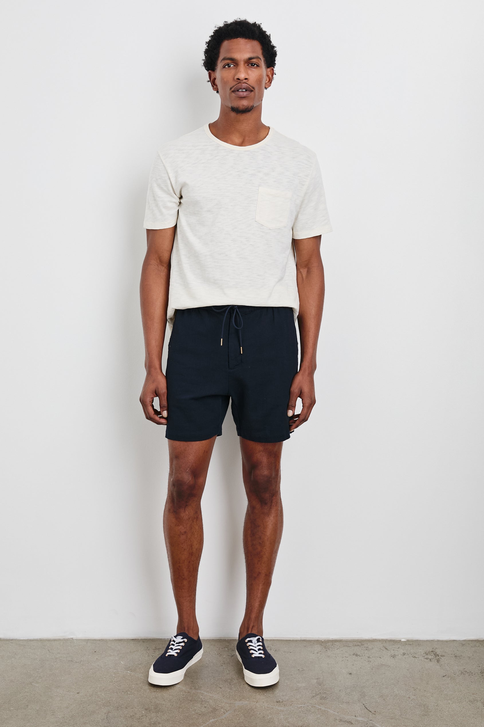 Archer Short in Cotton-Linen Blend With Relaxed Fit, Elastic Drawstring Waist, Front Zip Fly, Side Pockets, and Back Welt Pocket in Deep Meridian Colorway - Full Body Front View Featured on Model