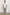 Aries mid length linen short in Diamond Oat Olive art deco pattern - full body front view on model