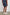 Aries Shorts with a Drawstring Waist, Two Front Pockets and a Buttoned Back Patch Pocket in Navy Cedar Vertical Colorway, with Thin Vertical Cedar Dashes on Navy - Back View Featured on Model