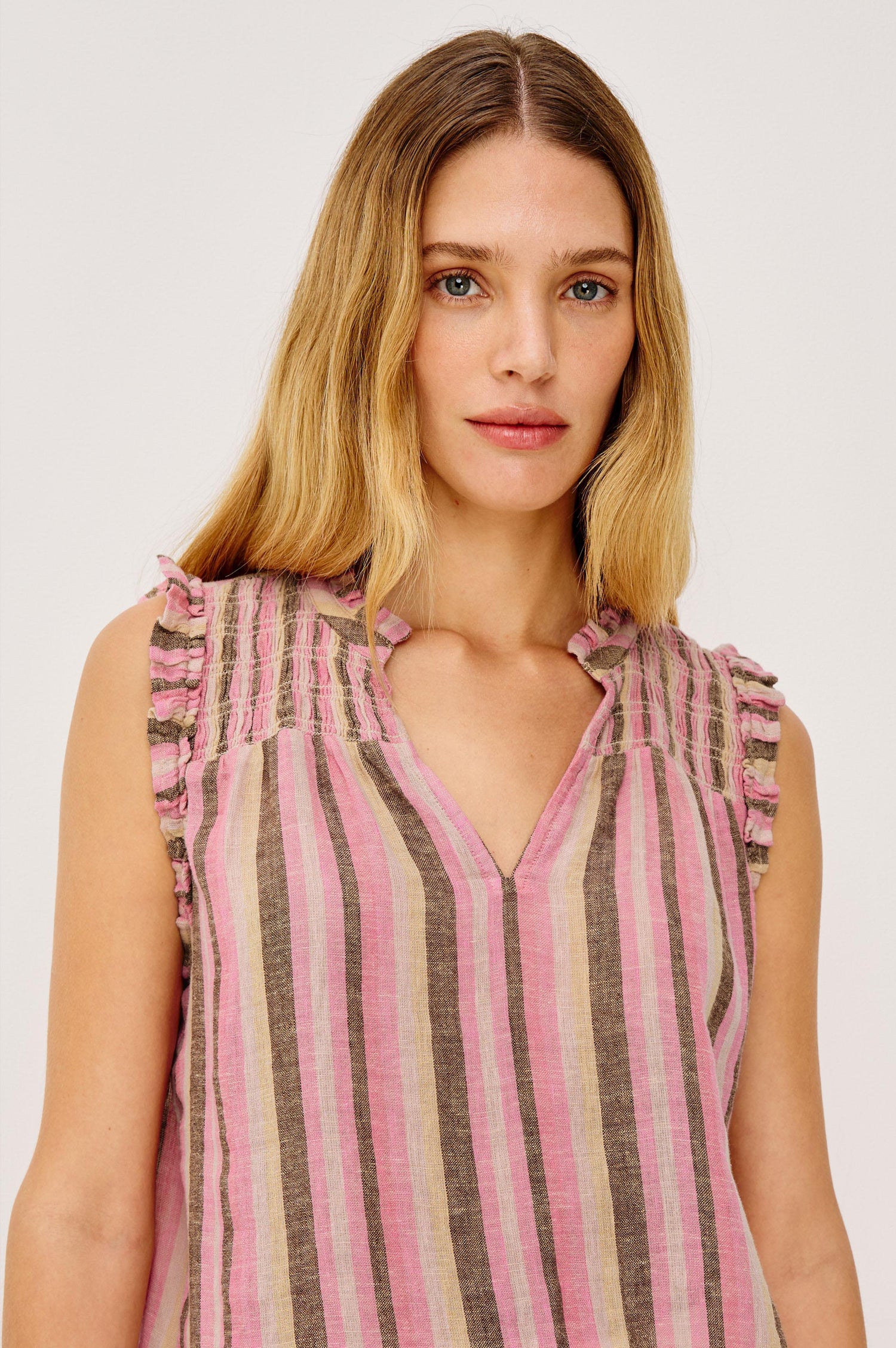 Arlene Sleeveless Top in Luxe Linen With V-Neckline, Pleated Collar, and Smocked Bodice in Cordoba Stripe Colorway - Upper Boy Front View Featured on Model
