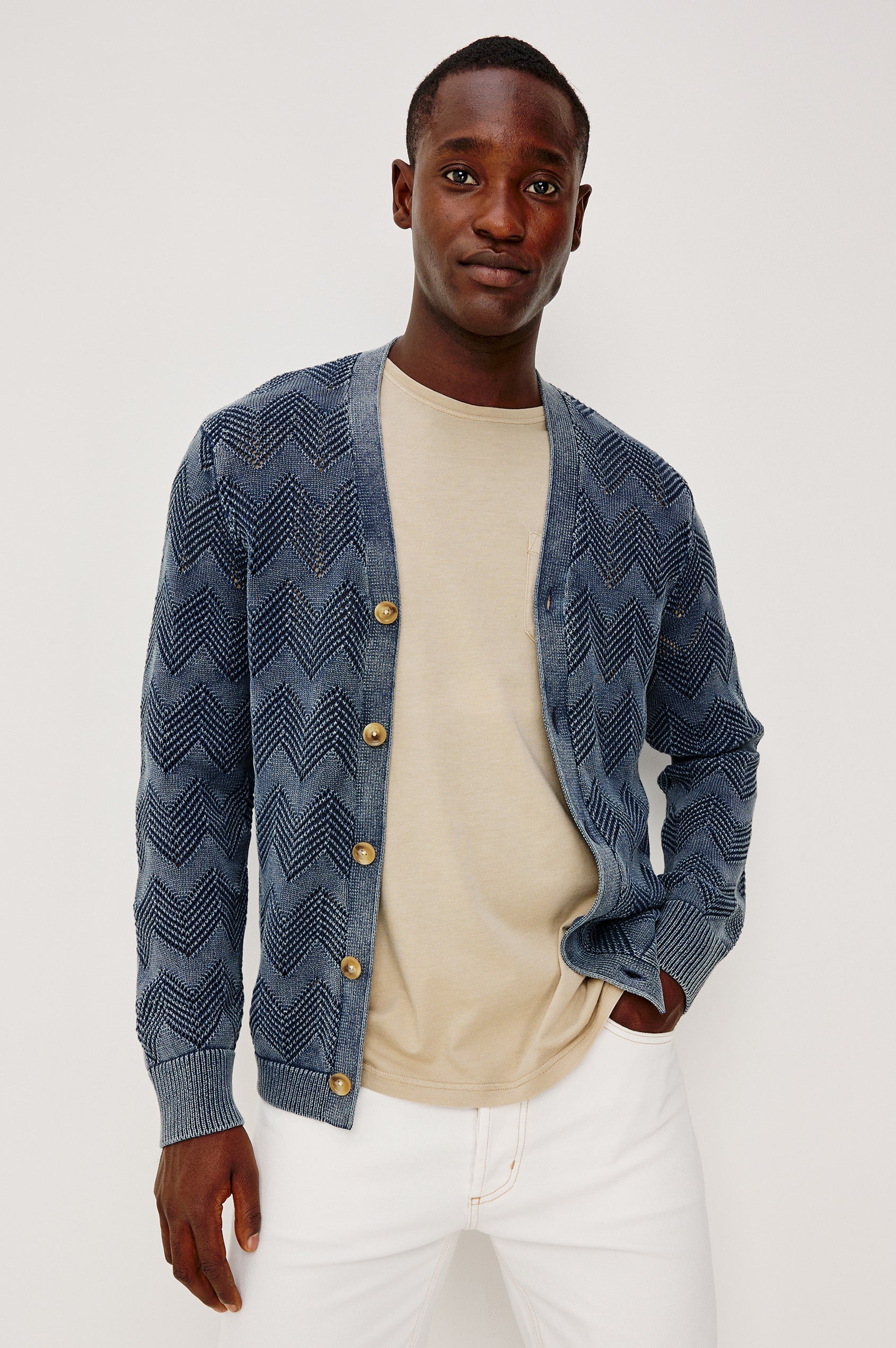 Ashe Cardigan Sweater in Jacquard Knit With Unique Spray-Wash Finish, Front Buttons, Regular Fit, and Long Sleeves in Sunfaded Navy Colorway - Upper Body Front View Featured on Model